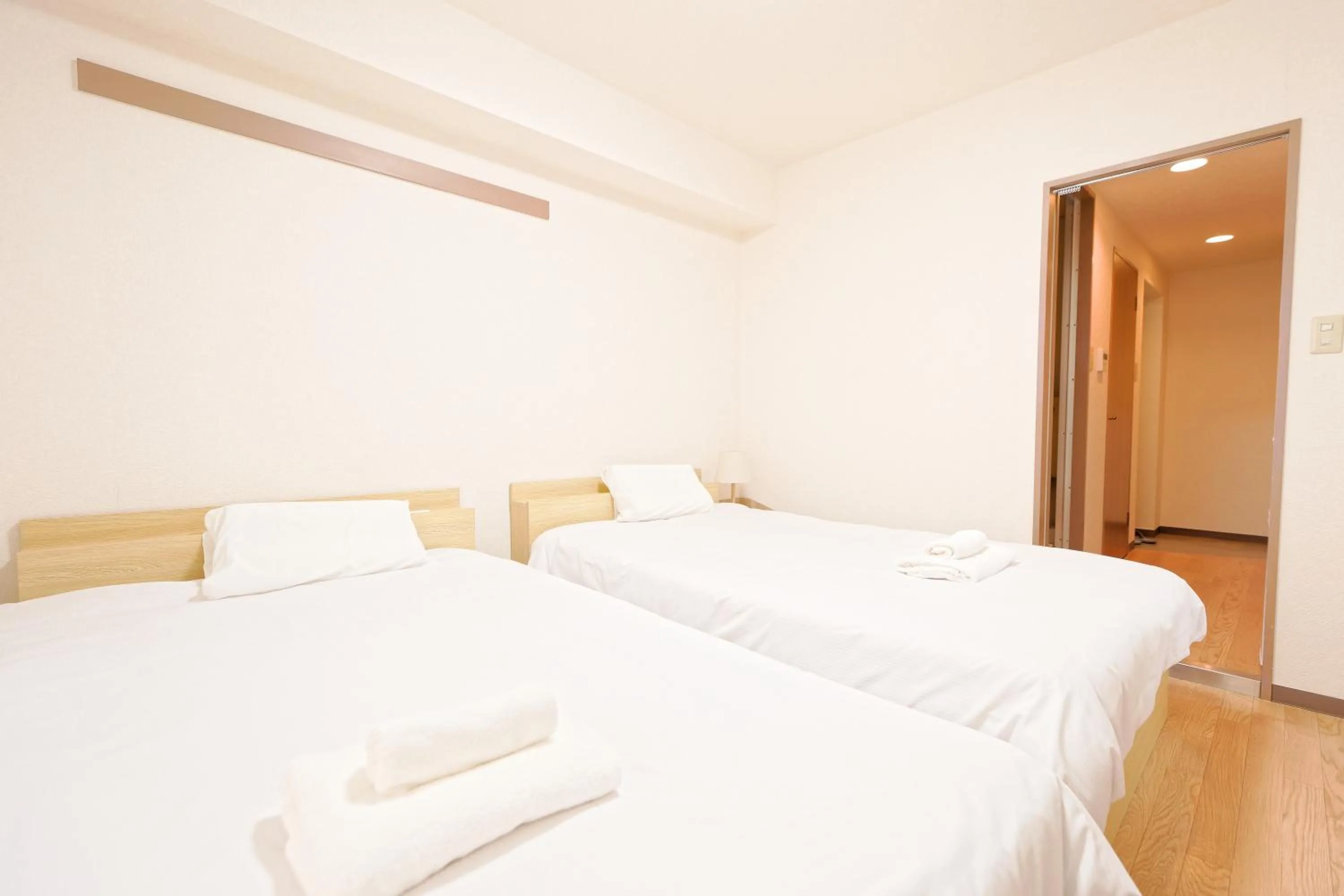 Bed in Shinjuku Waseda Earthtone Apartment