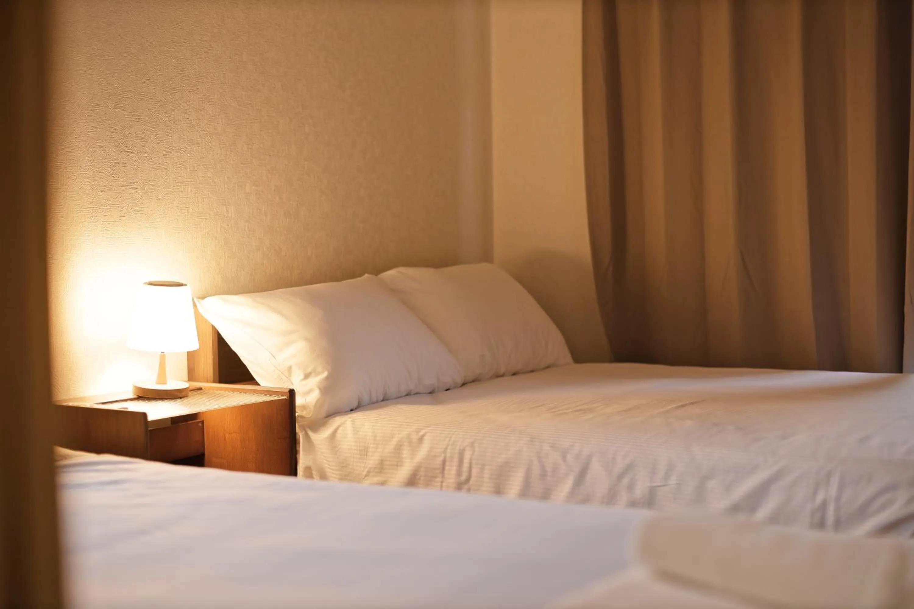 Bed in Shinjuku Waseda Earthtone Apartment