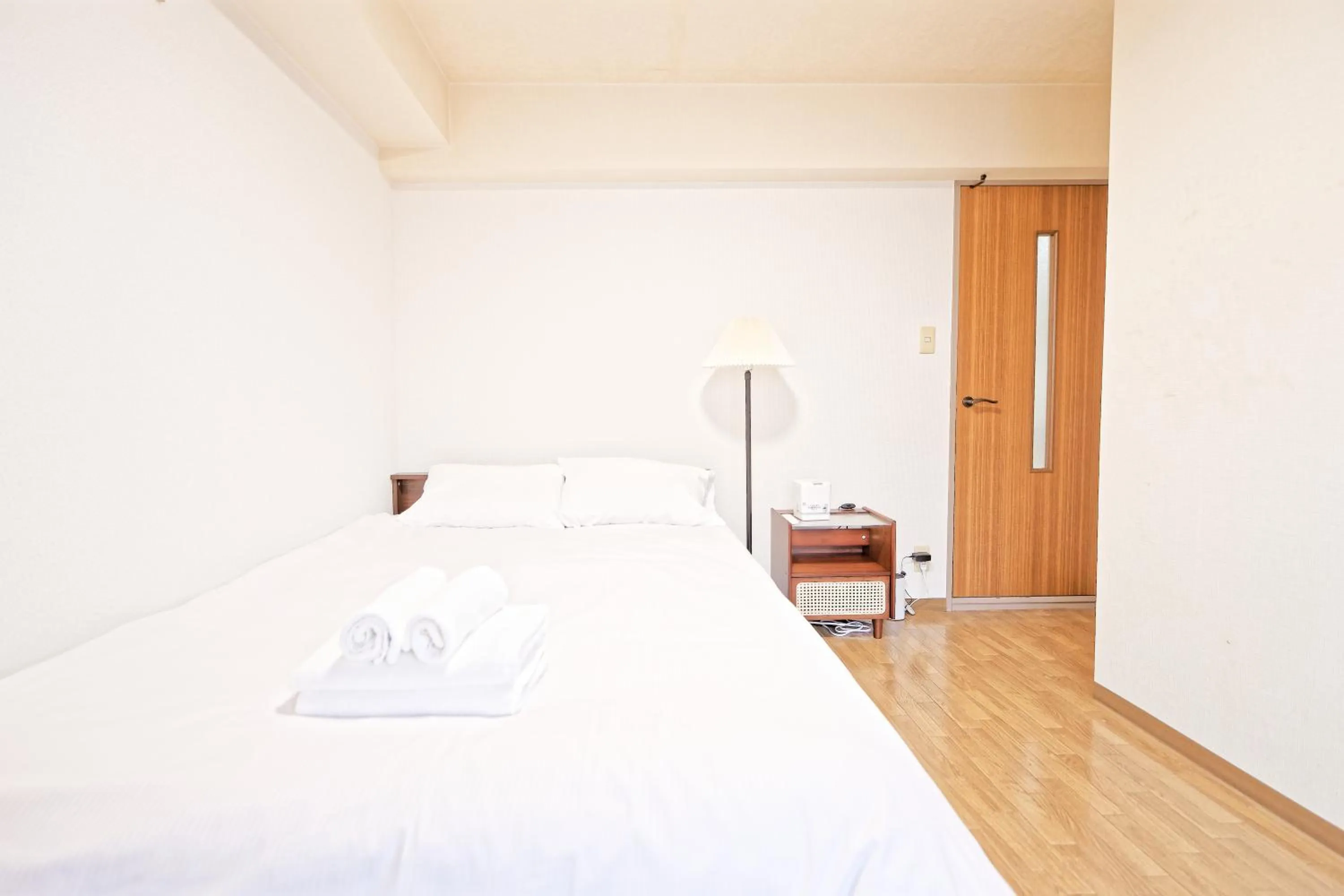Bed in Shinjuku Waseda Earthtone Apartment