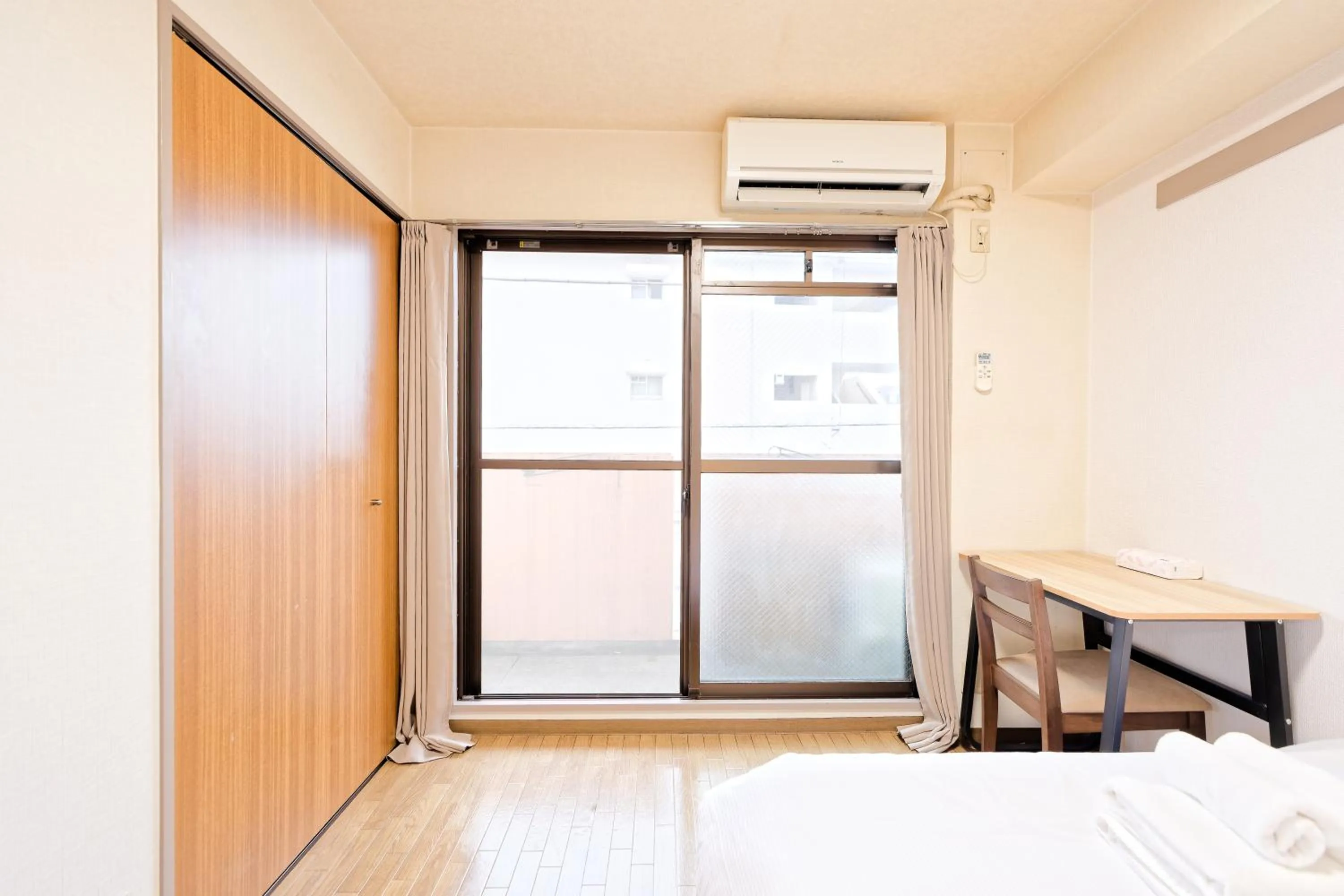 Bed in Shinjuku Waseda Earthtone Apartment