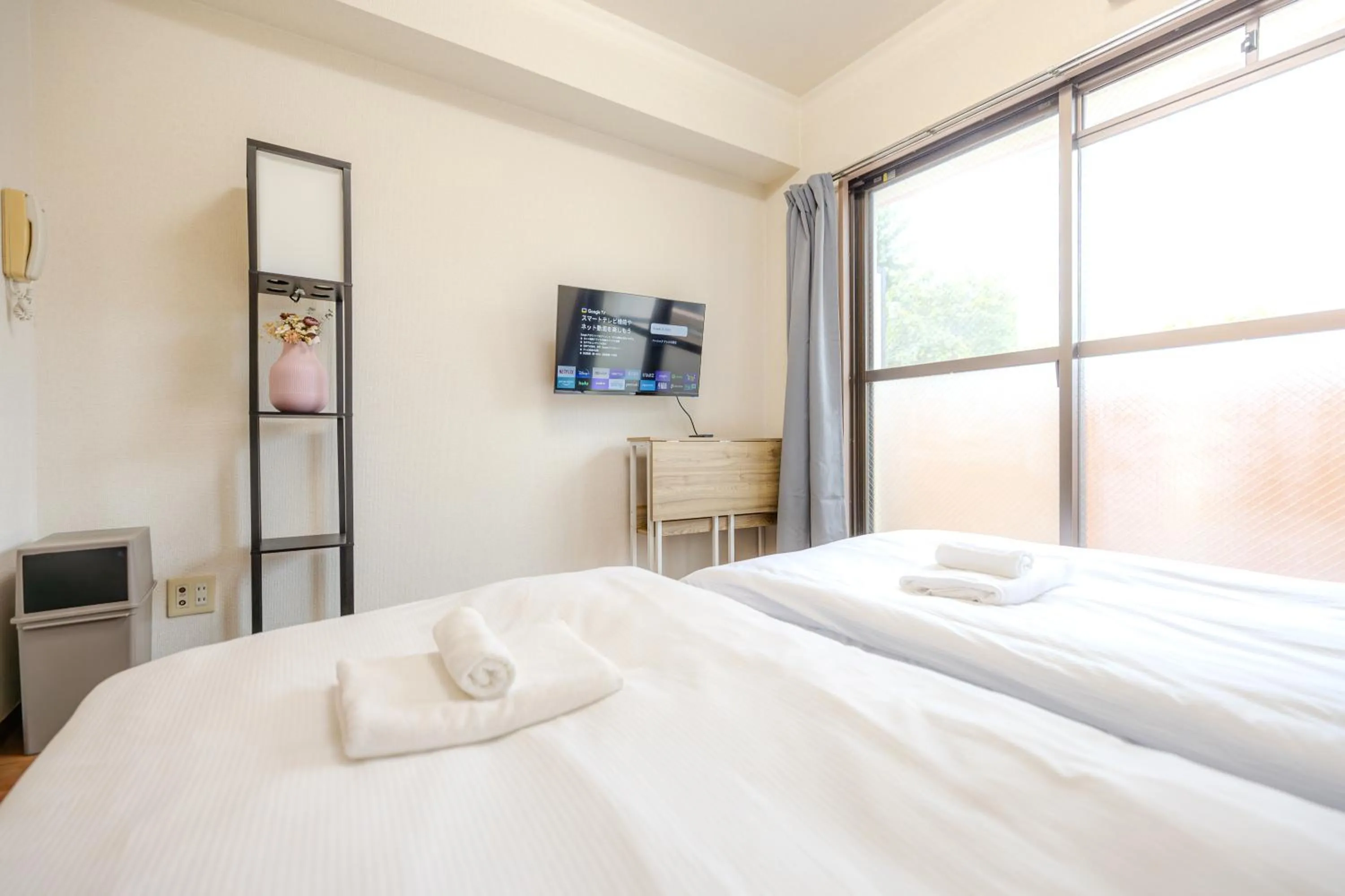 Bed in Shinjuku Waseda Earthtone Apartment