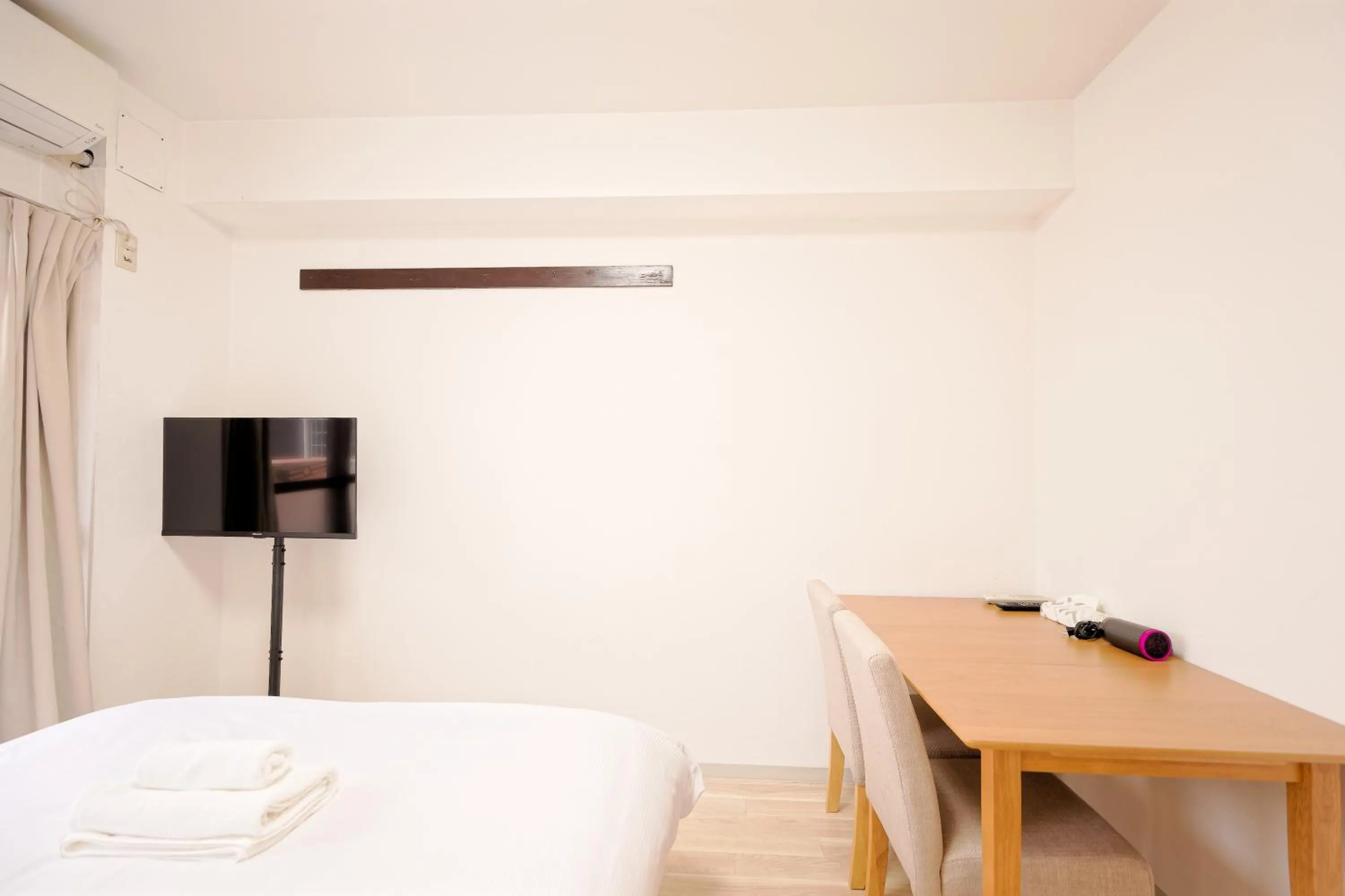 Bed in Shinjuku Waseda Earthtone Apartment
