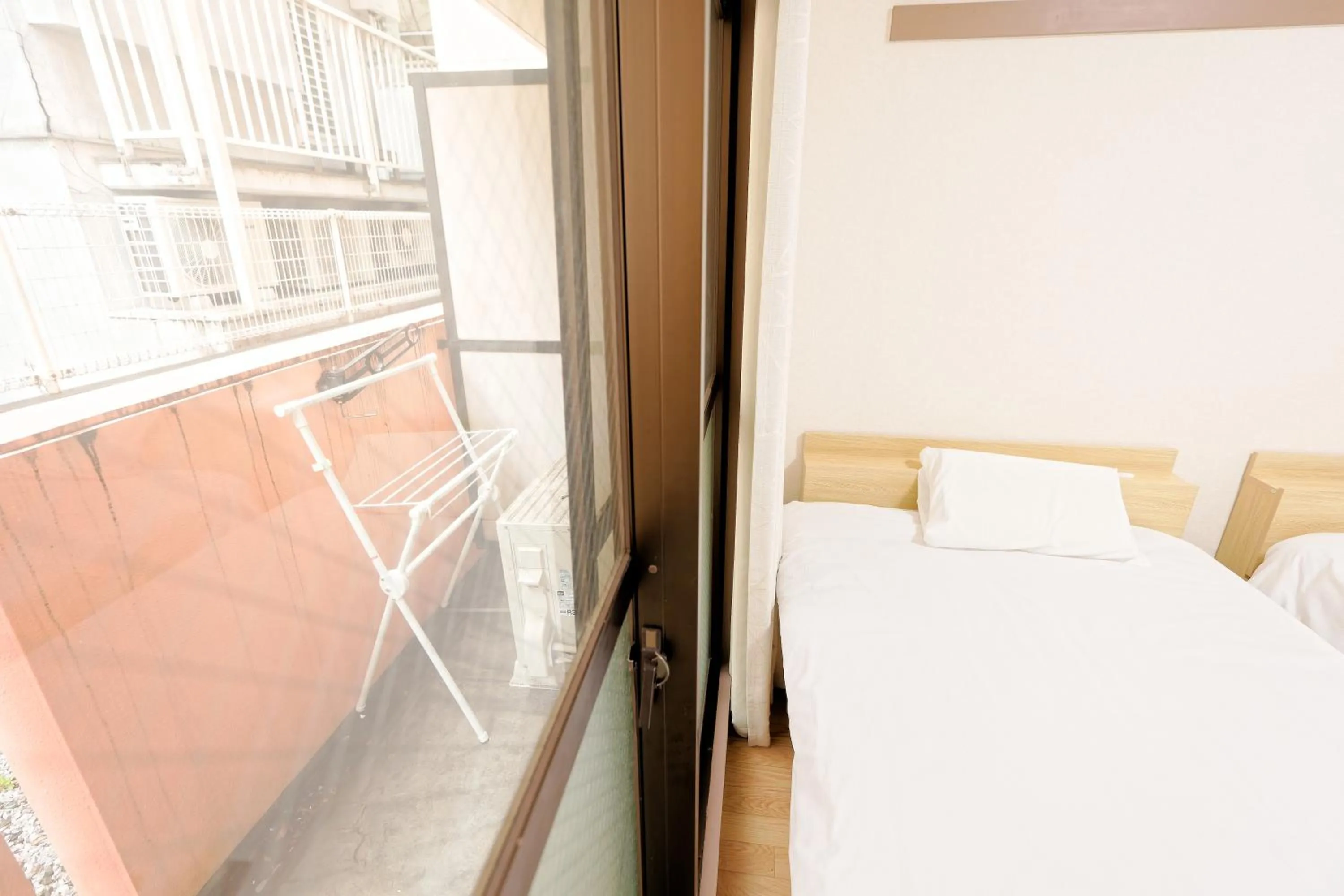 Bed in Shinjuku Waseda Earthtone Apartment