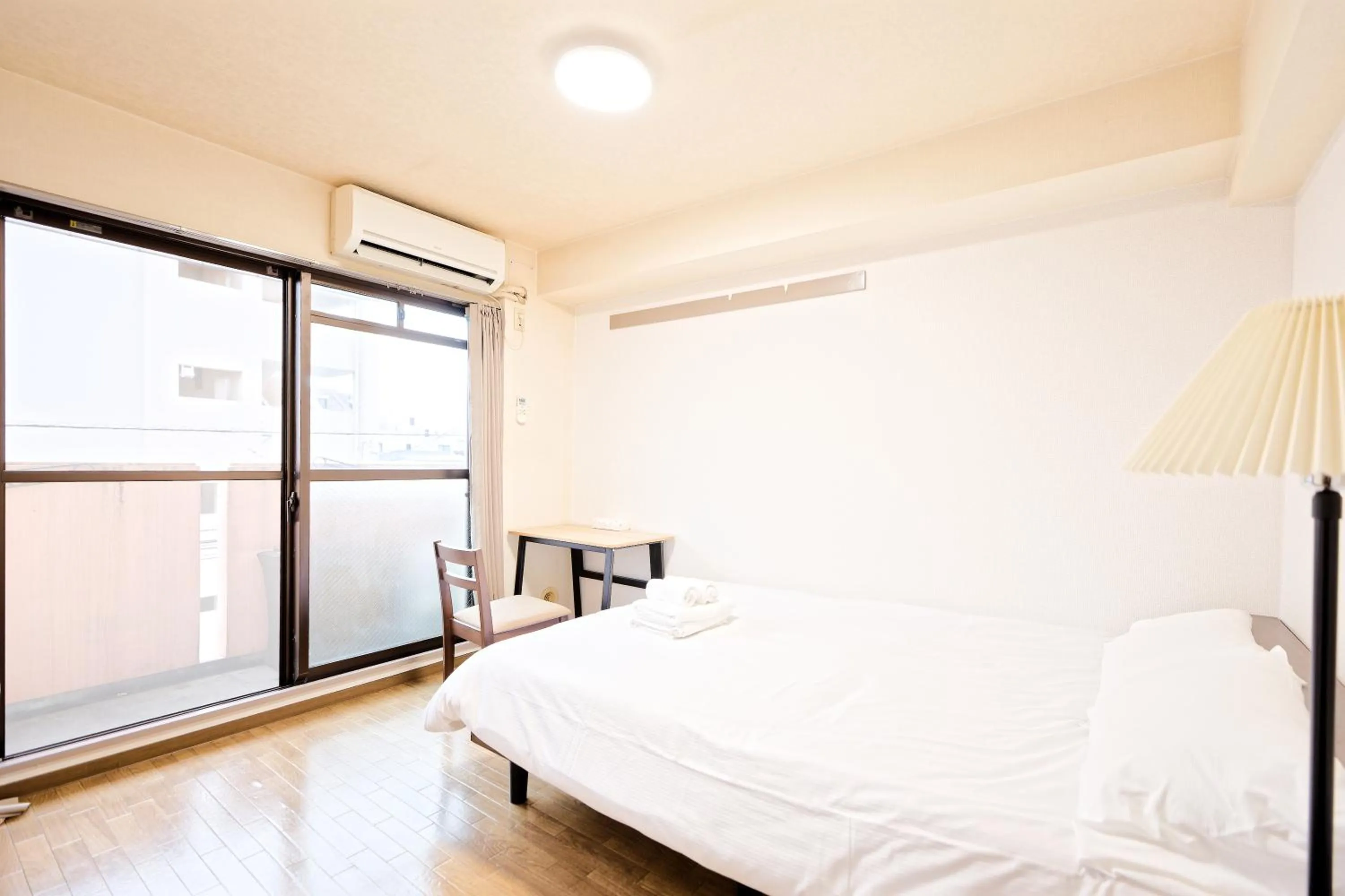 Bed in Shinjuku Waseda Earthtone Apartment