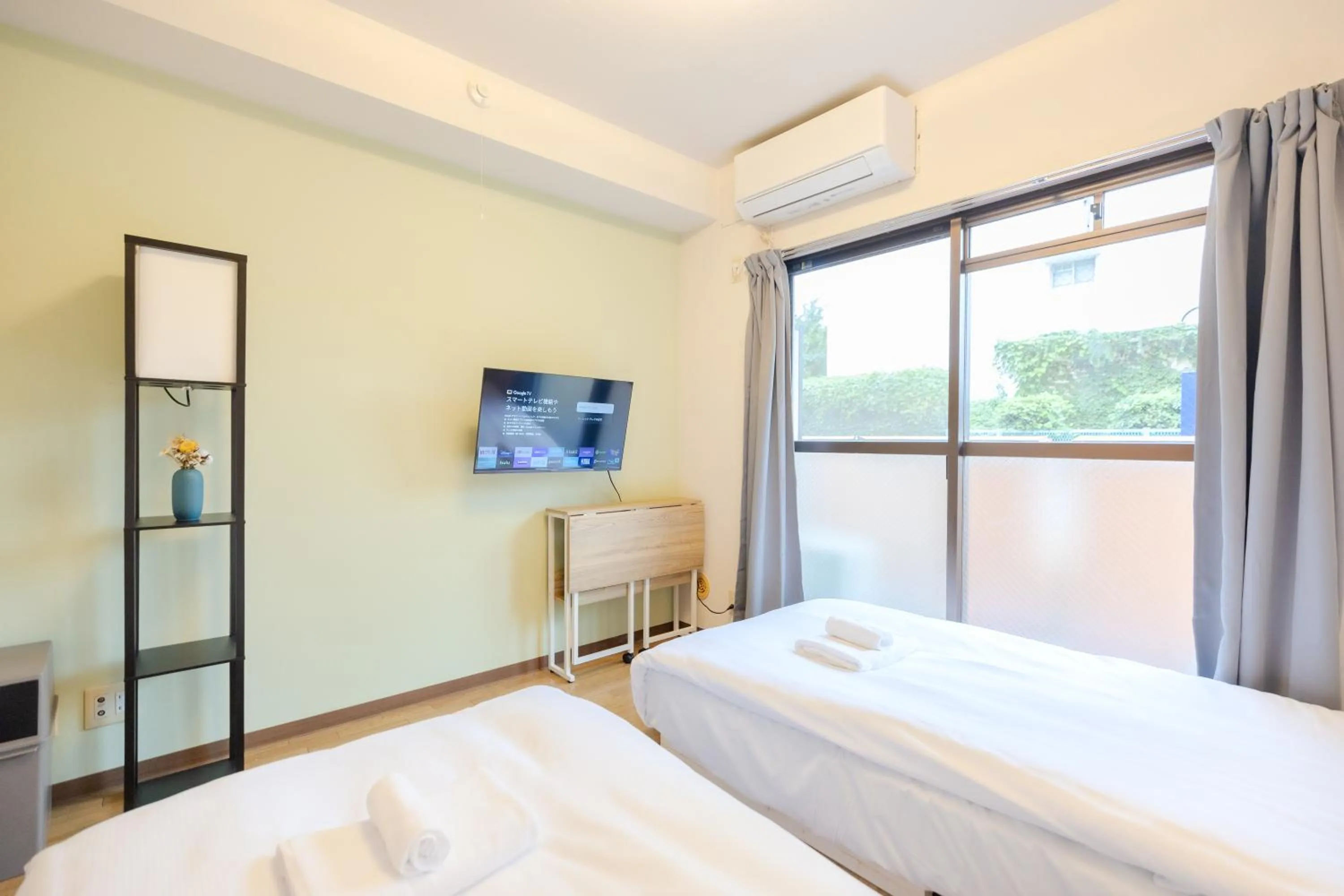 Bed in Shinjuku Waseda Earthtone Apartment