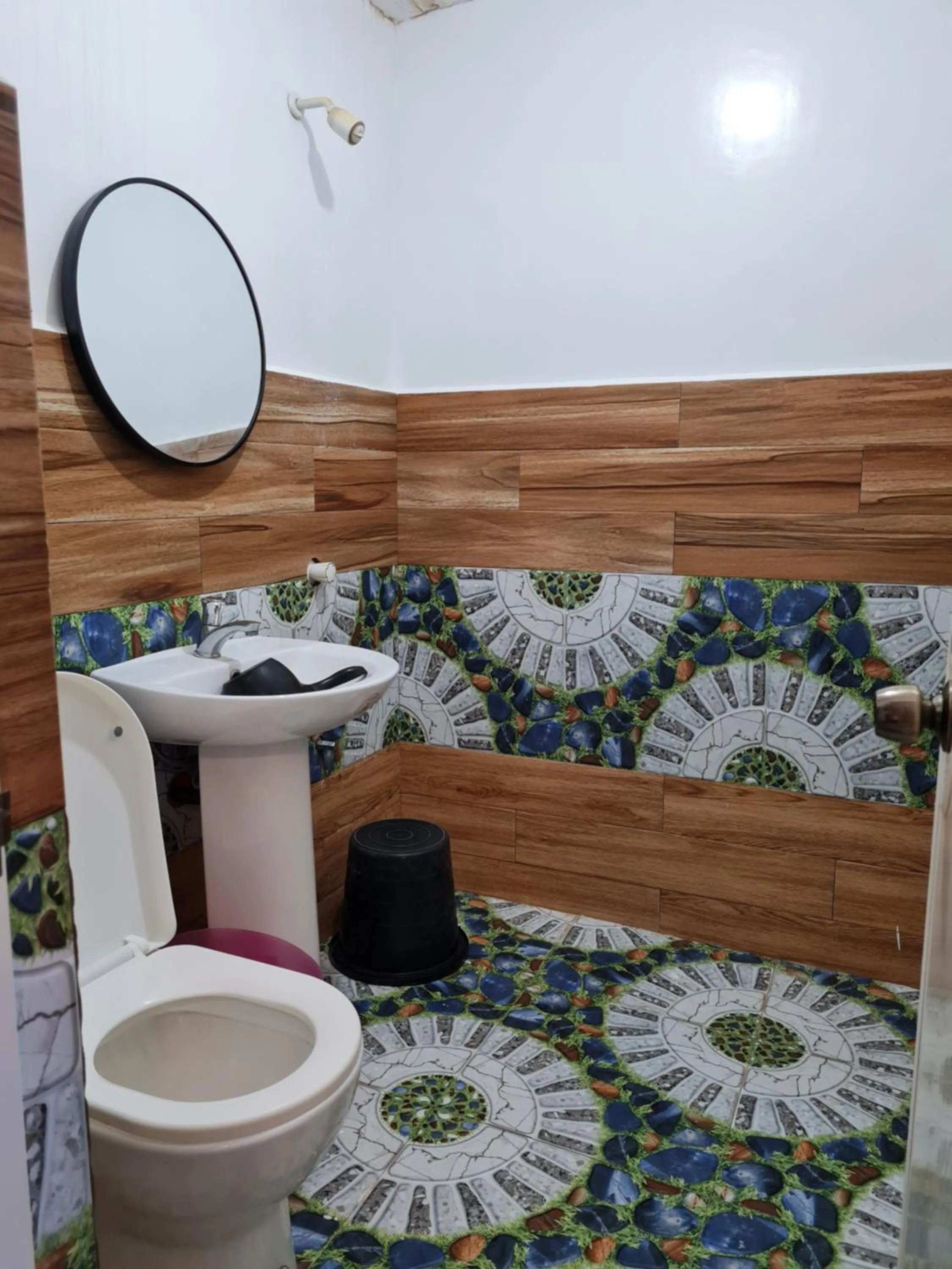 Toilet in Tambayan Rooms and Cottages by SMS Hospitality