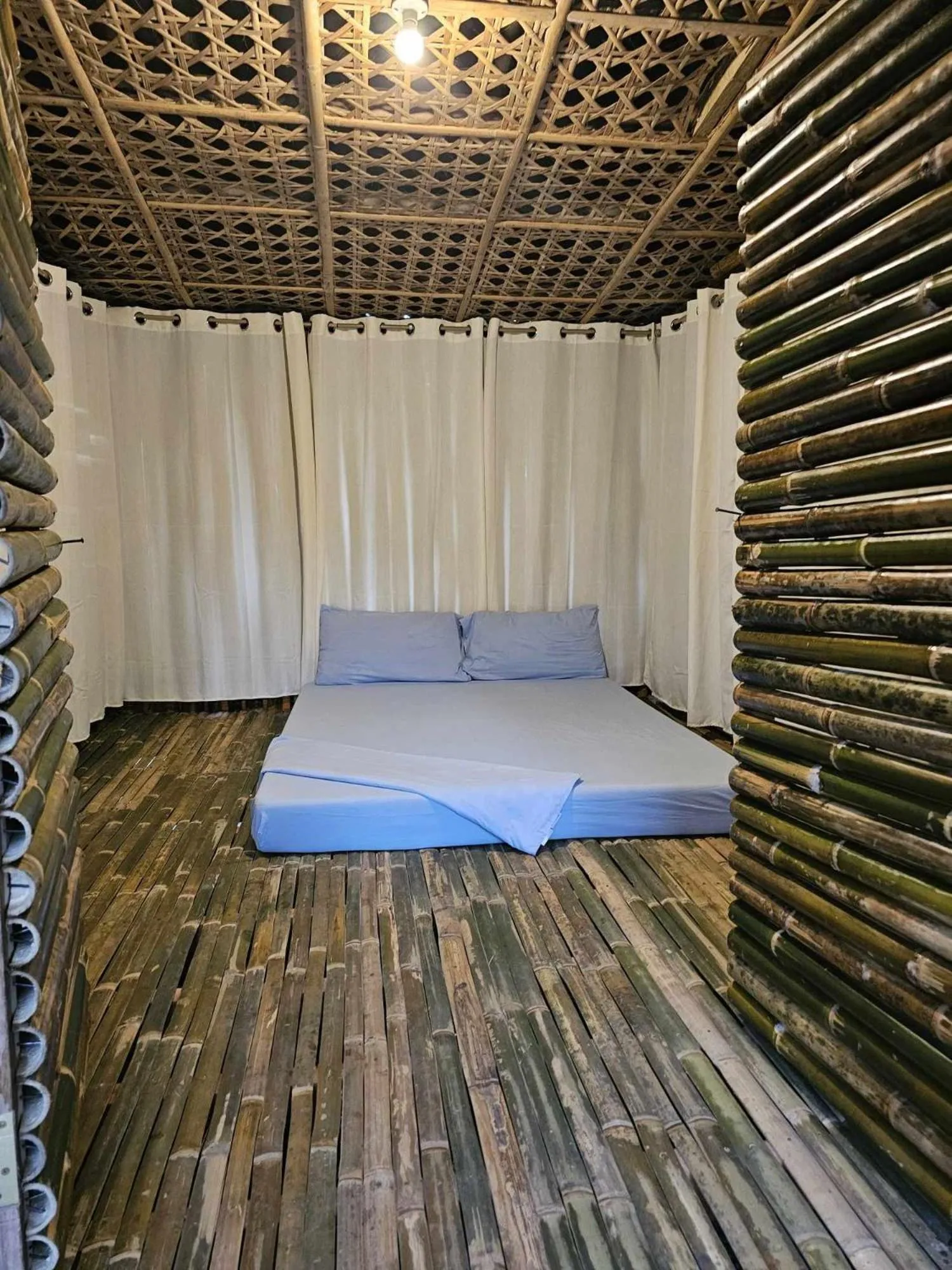 Photo of the whole room, Bed in Tambayan Rooms and Cottages by SMS Hospitality