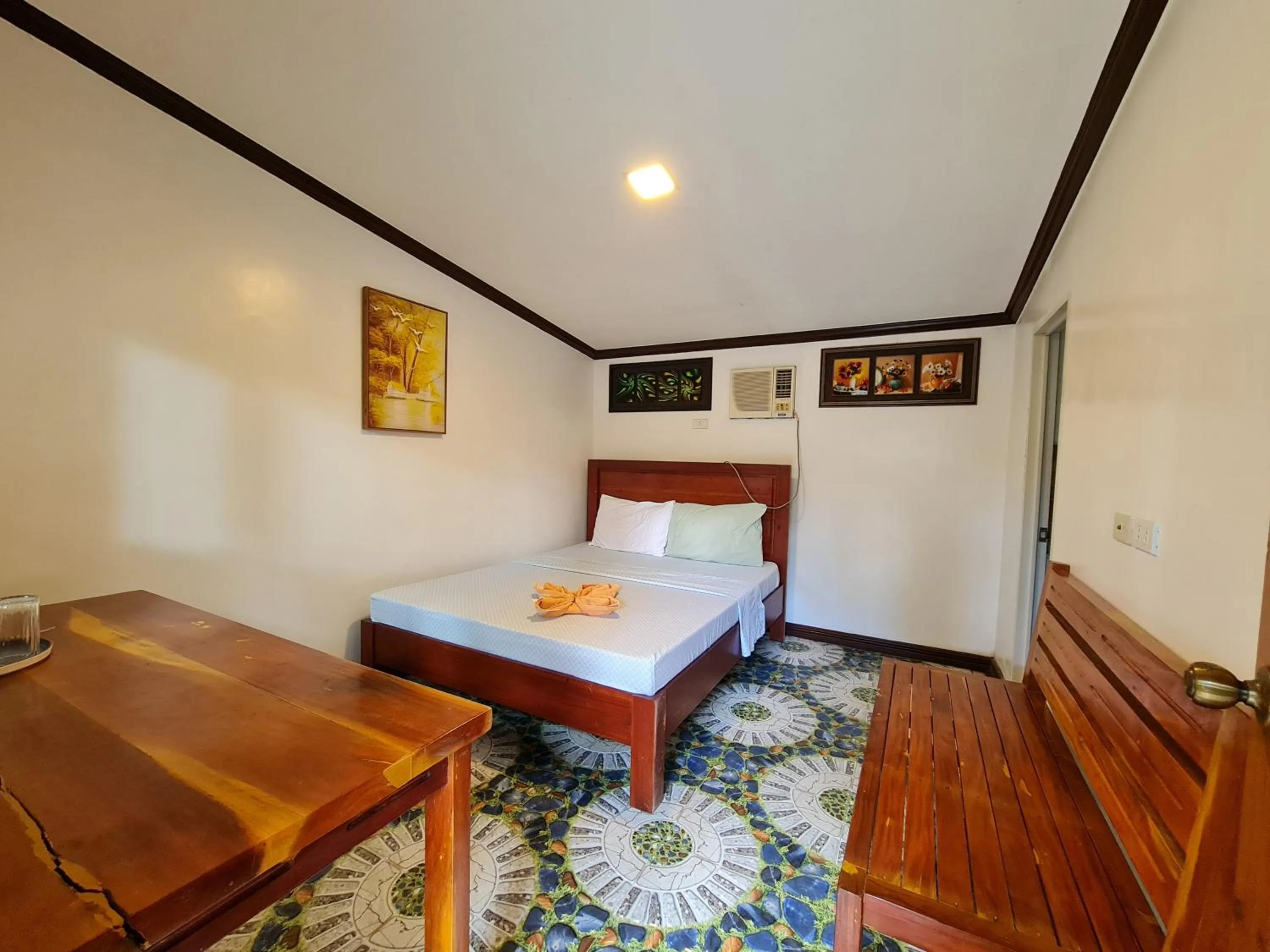 Bed in Tambayan Rooms and Cottages by SMS Hospitality