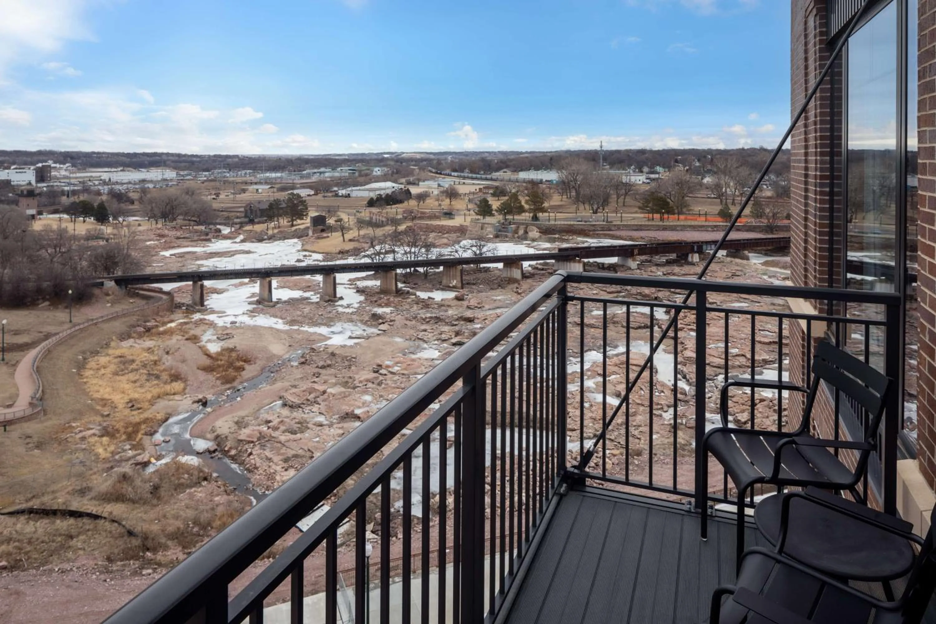 Corner King Room with Sofa Bed and Balcony - Falls Park View in Canopy By Hilton Sioux Falls Downtown