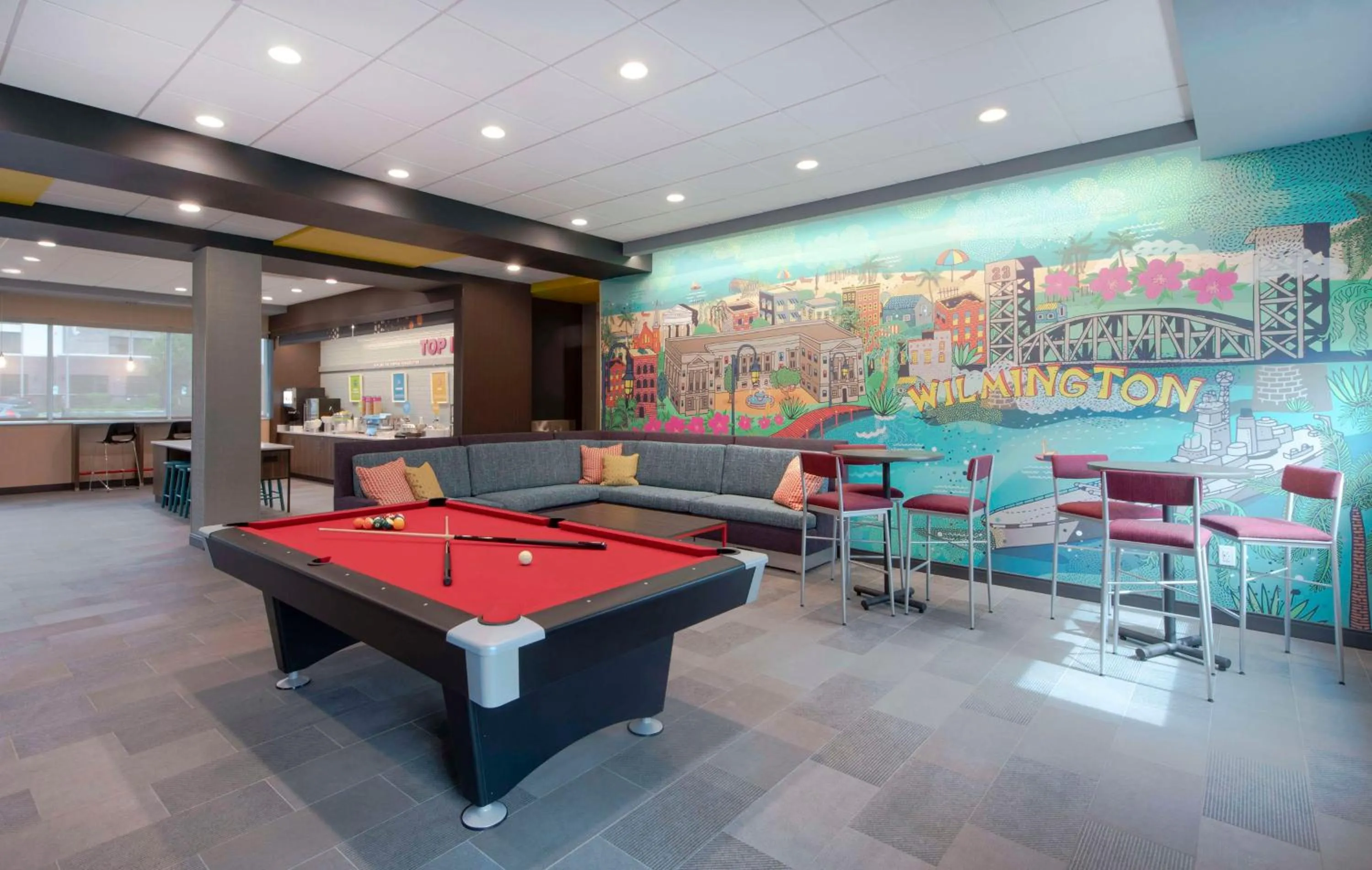 Communal lounge/ TV room in Tru by Hilton Wilmington Wrightsville Beach