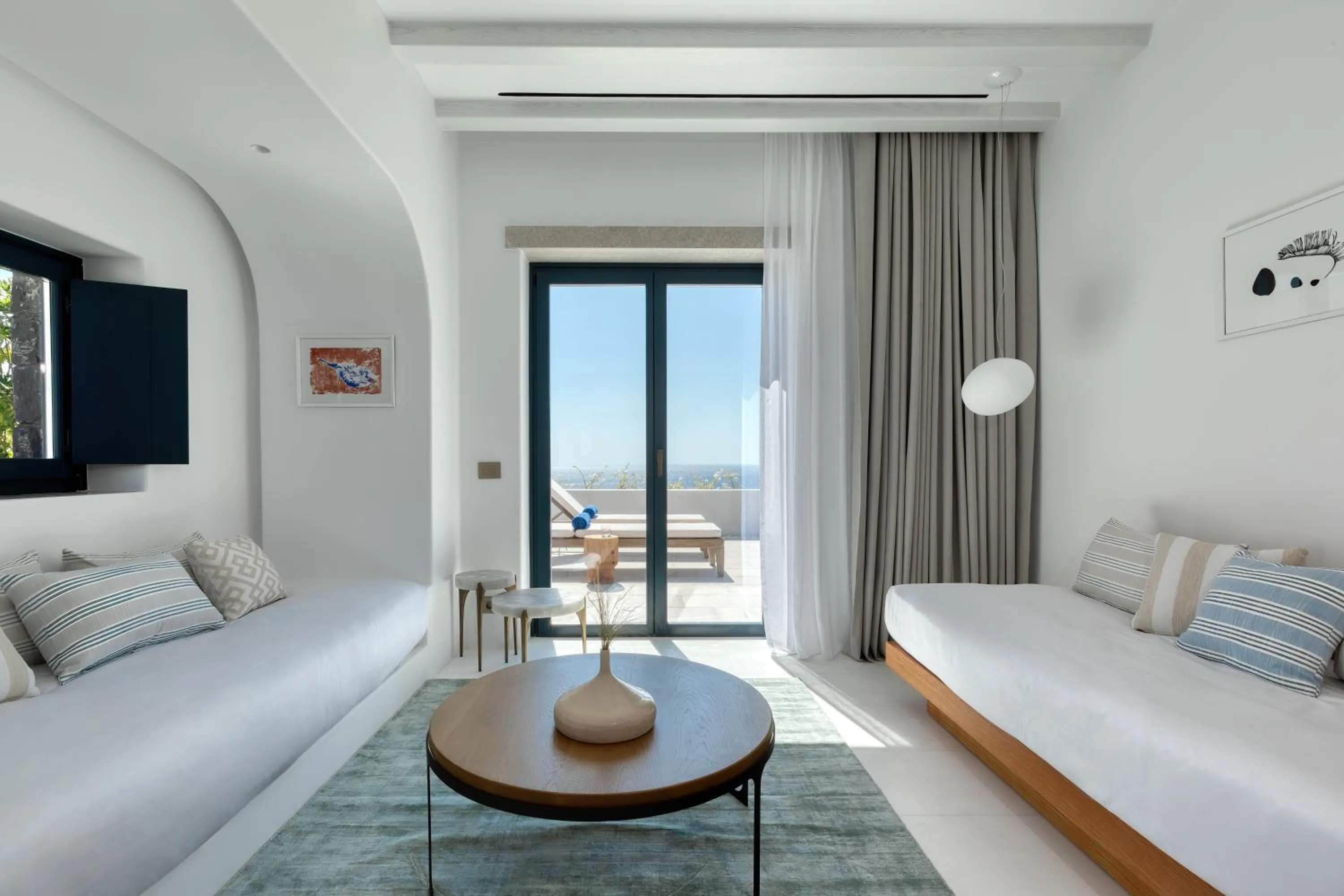 Seating area, Bed in Sandblu Santorini, LXR Hotels & Resorts