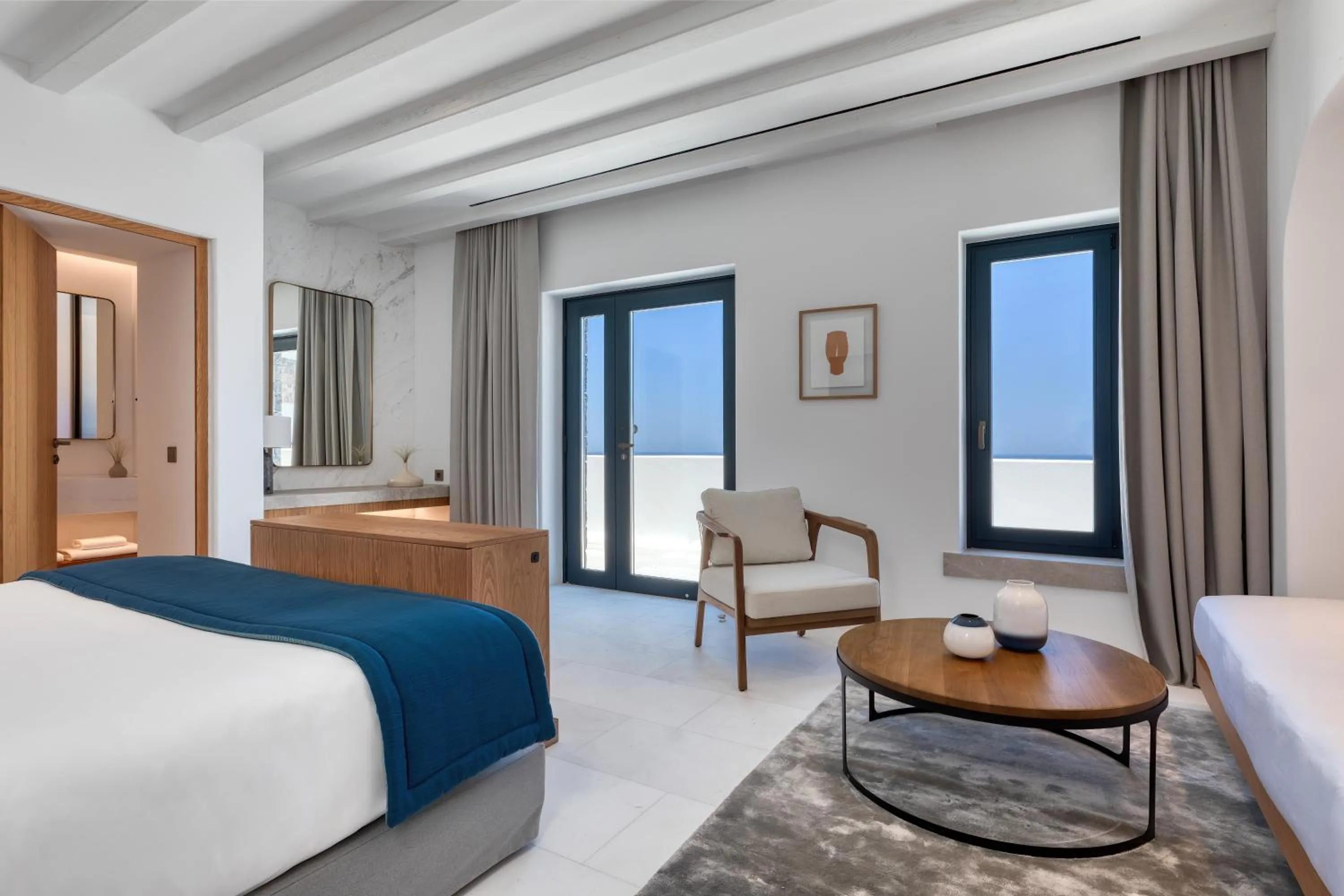 Bed in Sandblu Santorini, LXR Hotels & Resorts