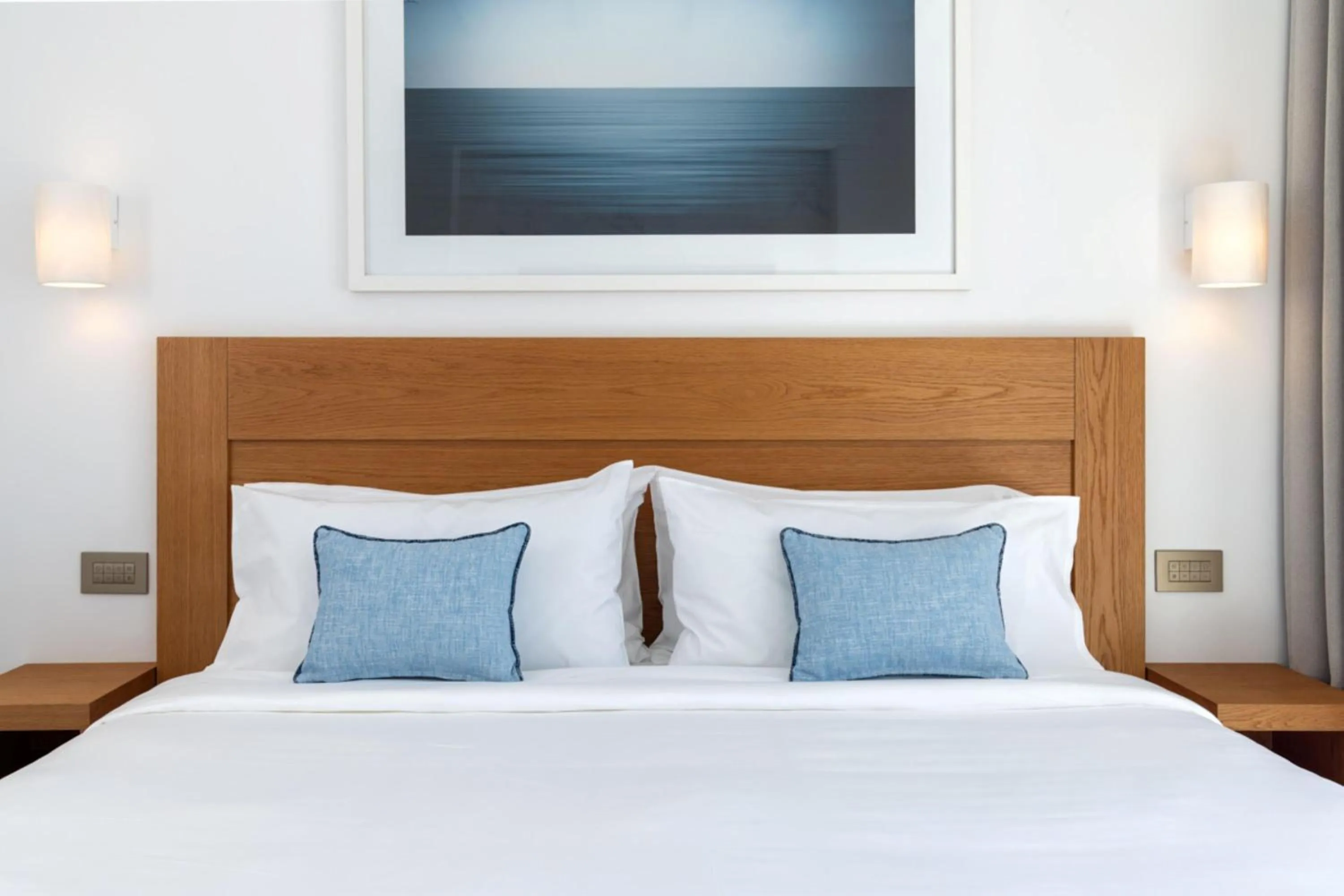 Bed in Sandblu Santorini, LXR Hotels & Resorts