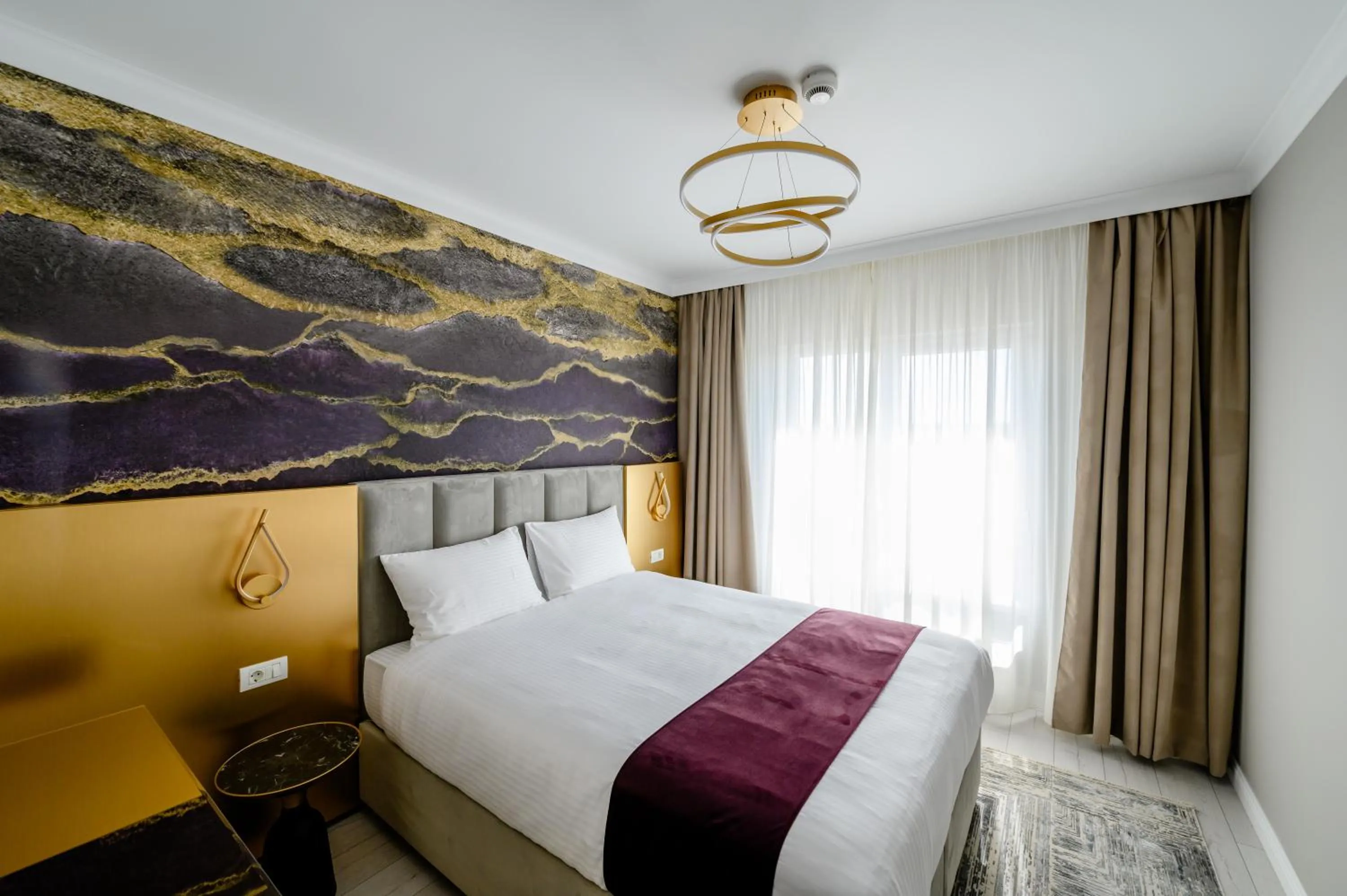 Bed in Elitte Inn & Suites