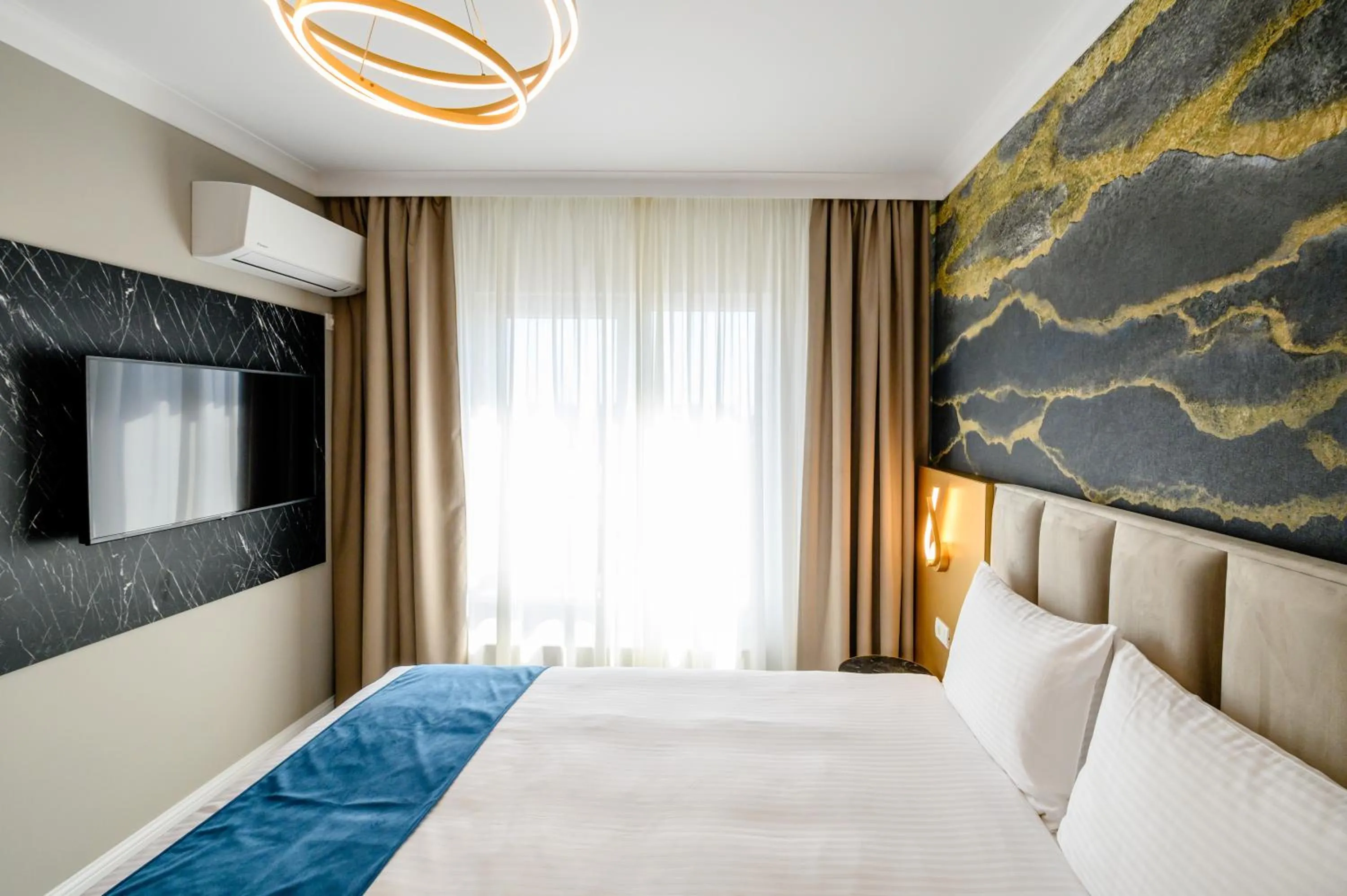 Bed in Elitte Inn & Suites