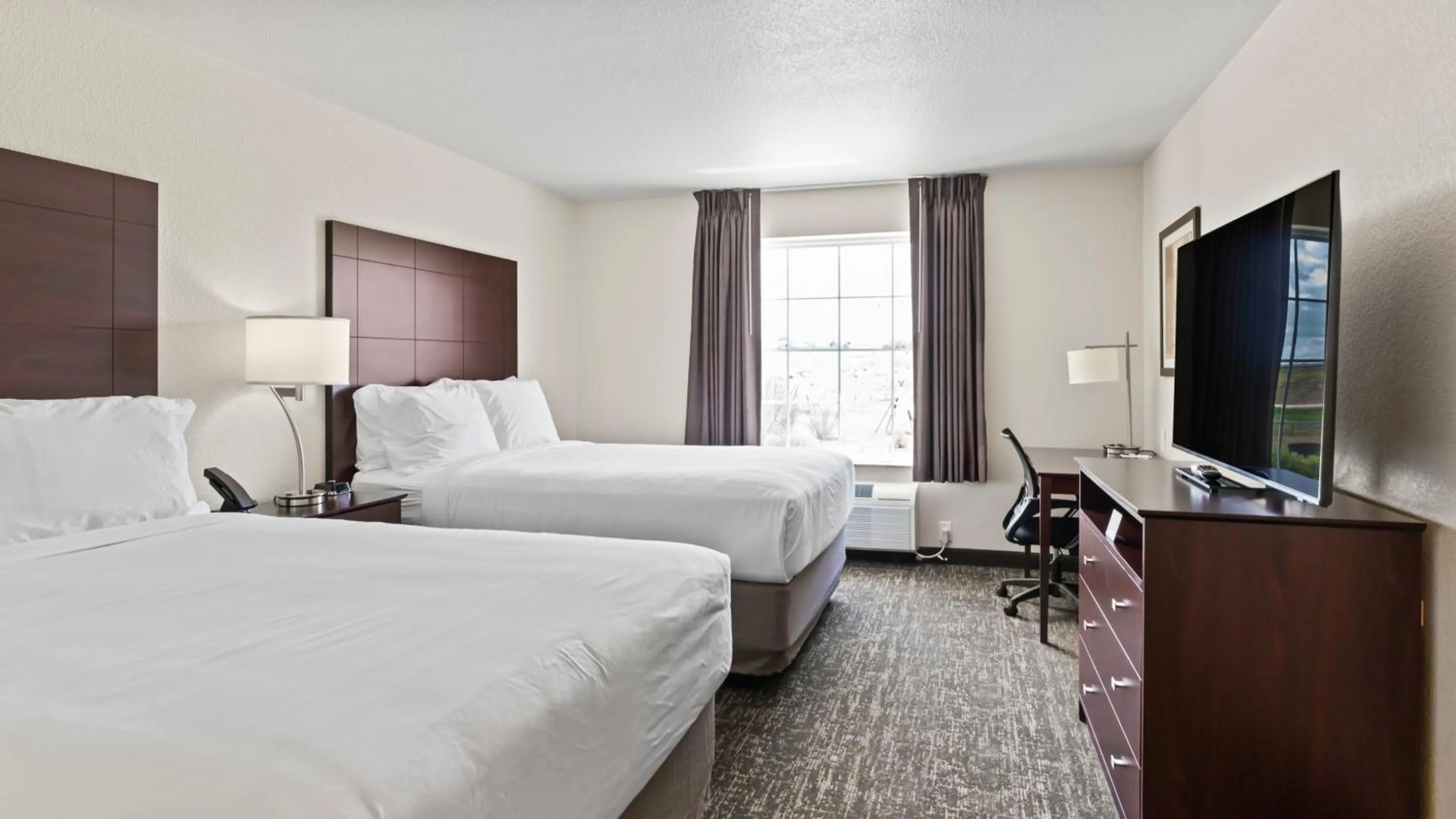 Bed in Cobblestone Inn & Suites - Julesburg