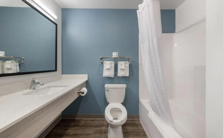 Bathroom in WoodSpring Suites Winston-Salem near Hanes Mall