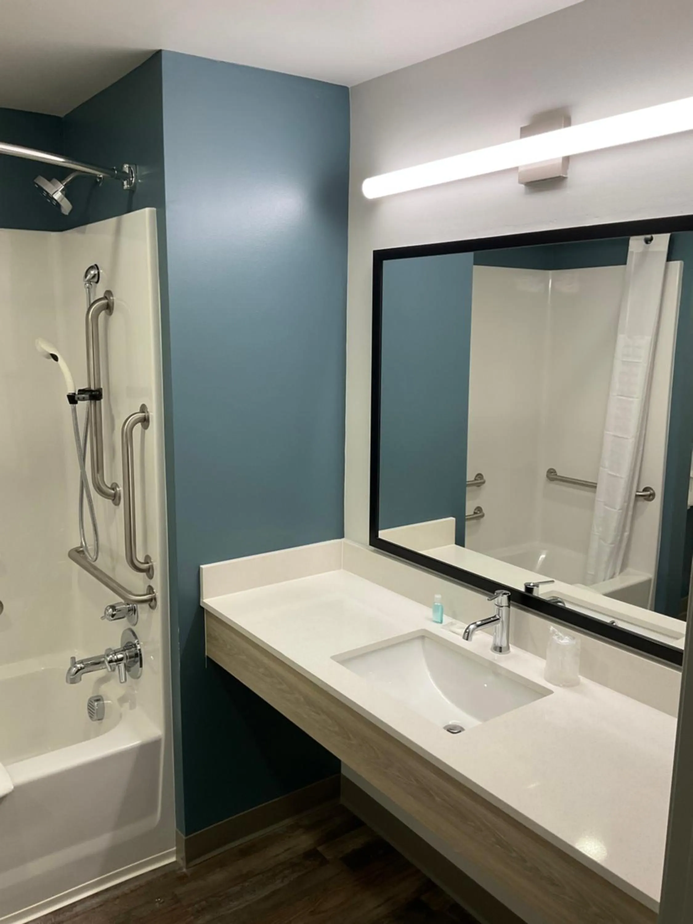 Bathroom in WoodSpring Suites Winston-Salem near Hanes Mall