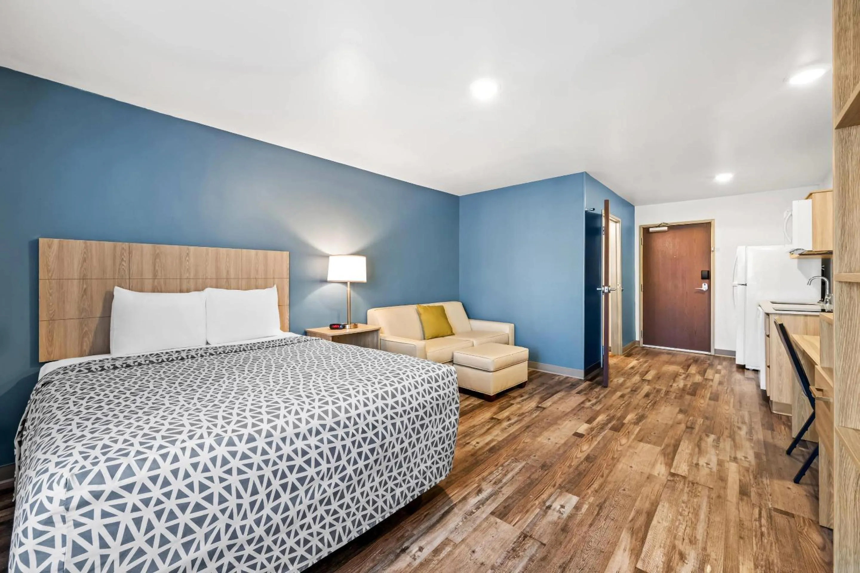 Bedroom, Bed in WoodSpring Suites Winston-Salem near Hanes Mall