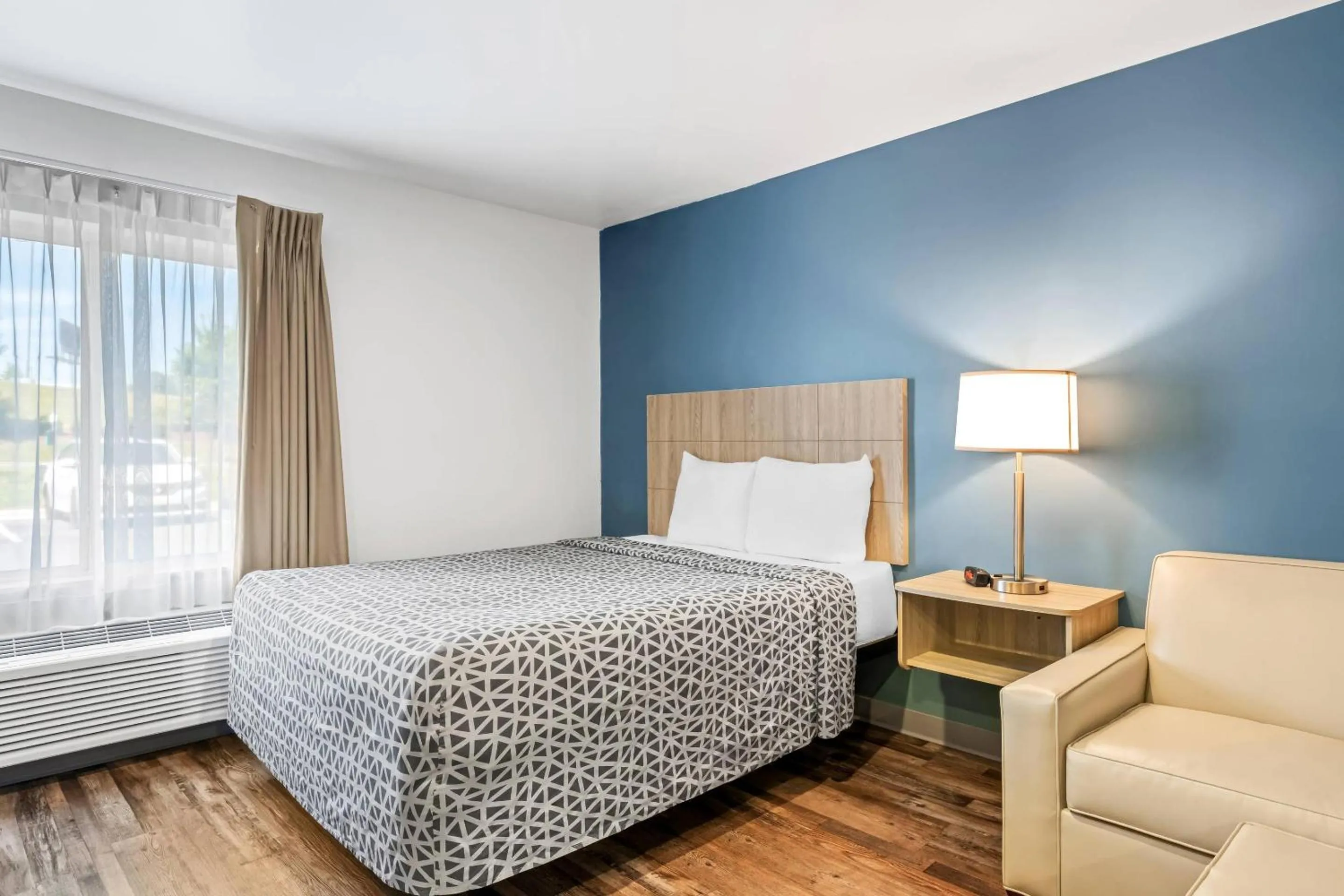 Bedroom, Bed in WoodSpring Suites Winston-Salem near Hanes Mall