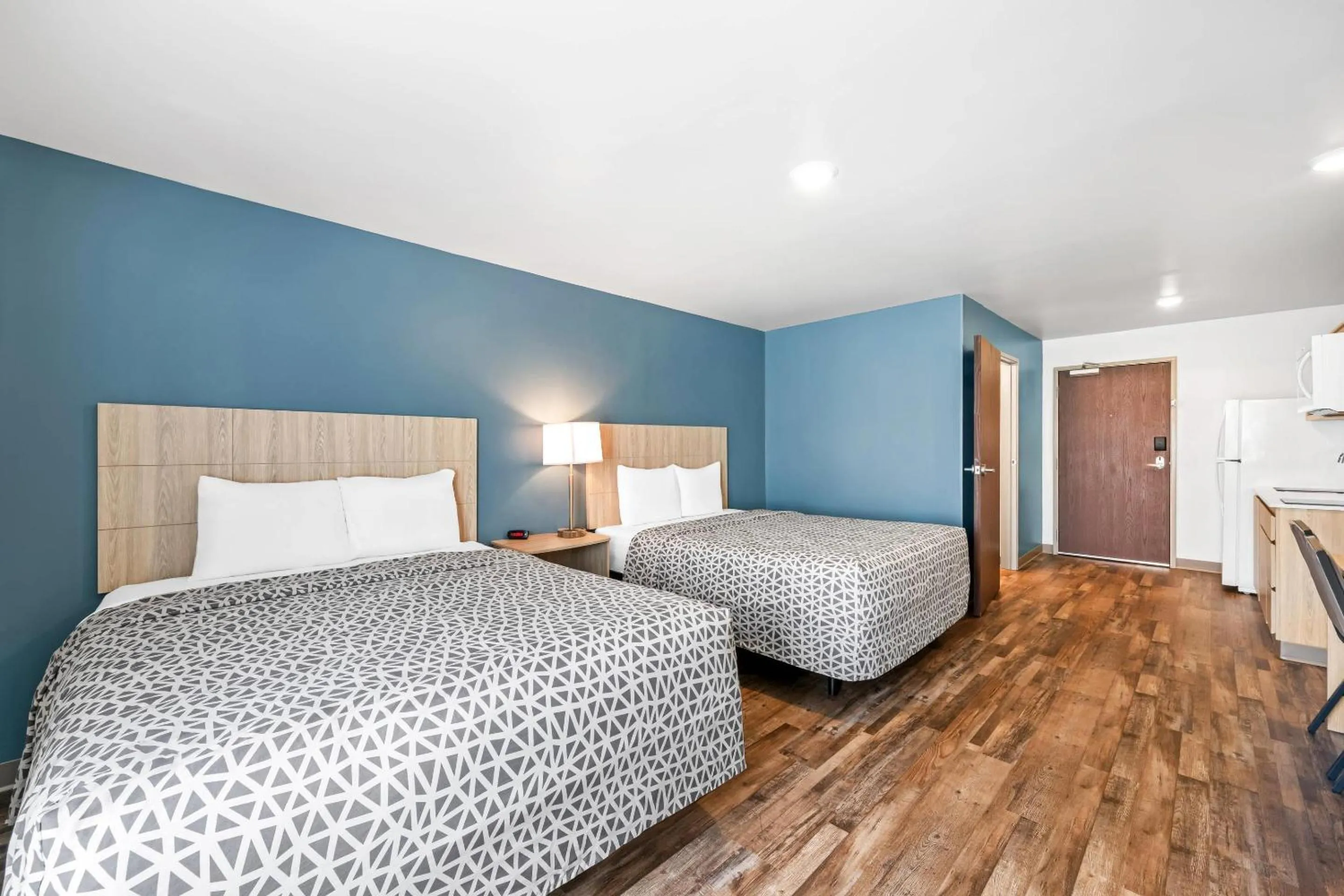 Bedroom, Bed in WoodSpring Suites Winston-Salem near Hanes Mall