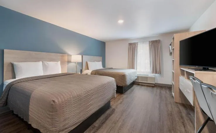 Bed in WoodSpring Suites Winston-Salem near Hanes Mall