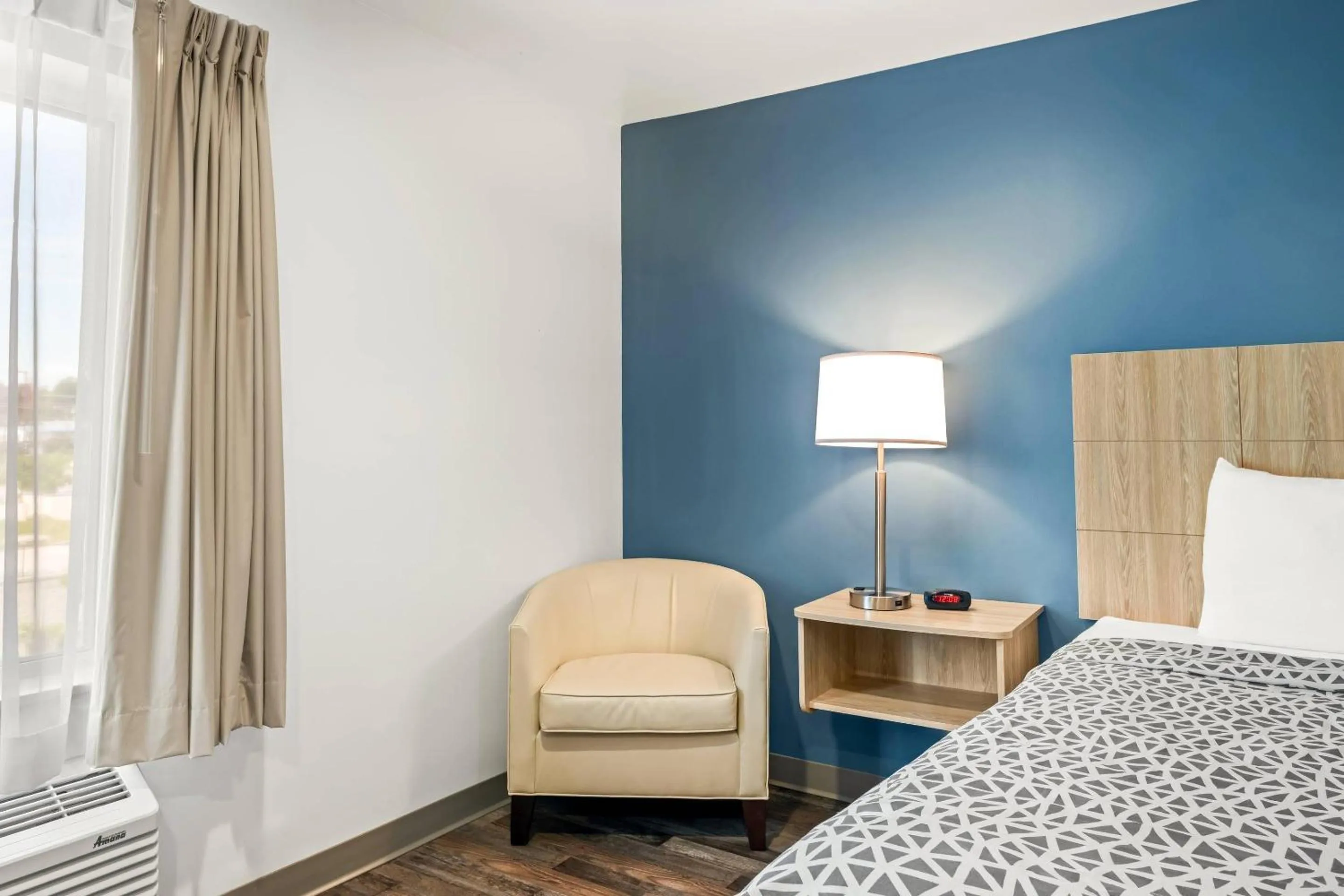 Bedroom, Bed in WoodSpring Suites Winston-Salem near Hanes Mall