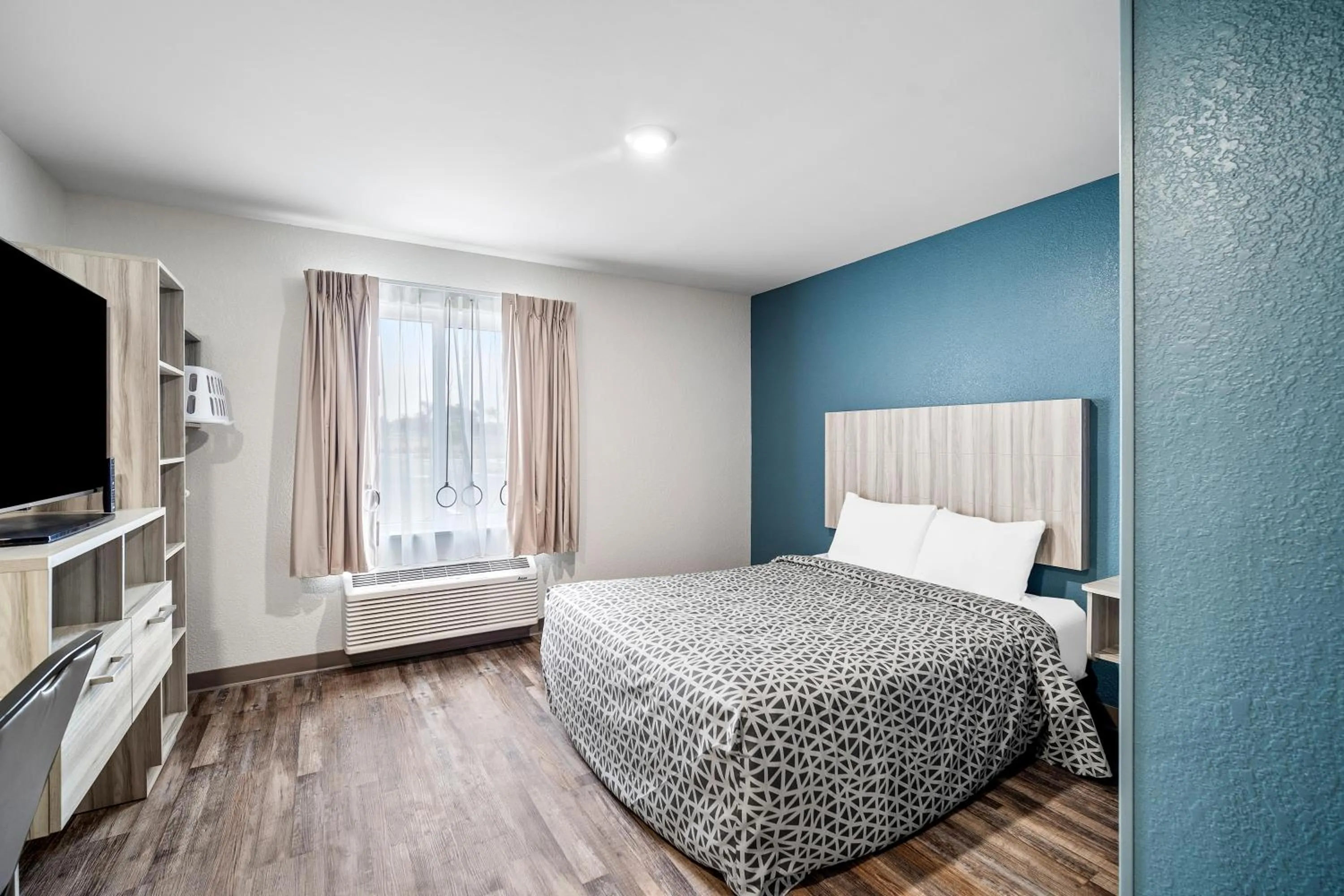 Bedroom, Bed in WoodSpring Suites Winston-Salem near Hanes Mall