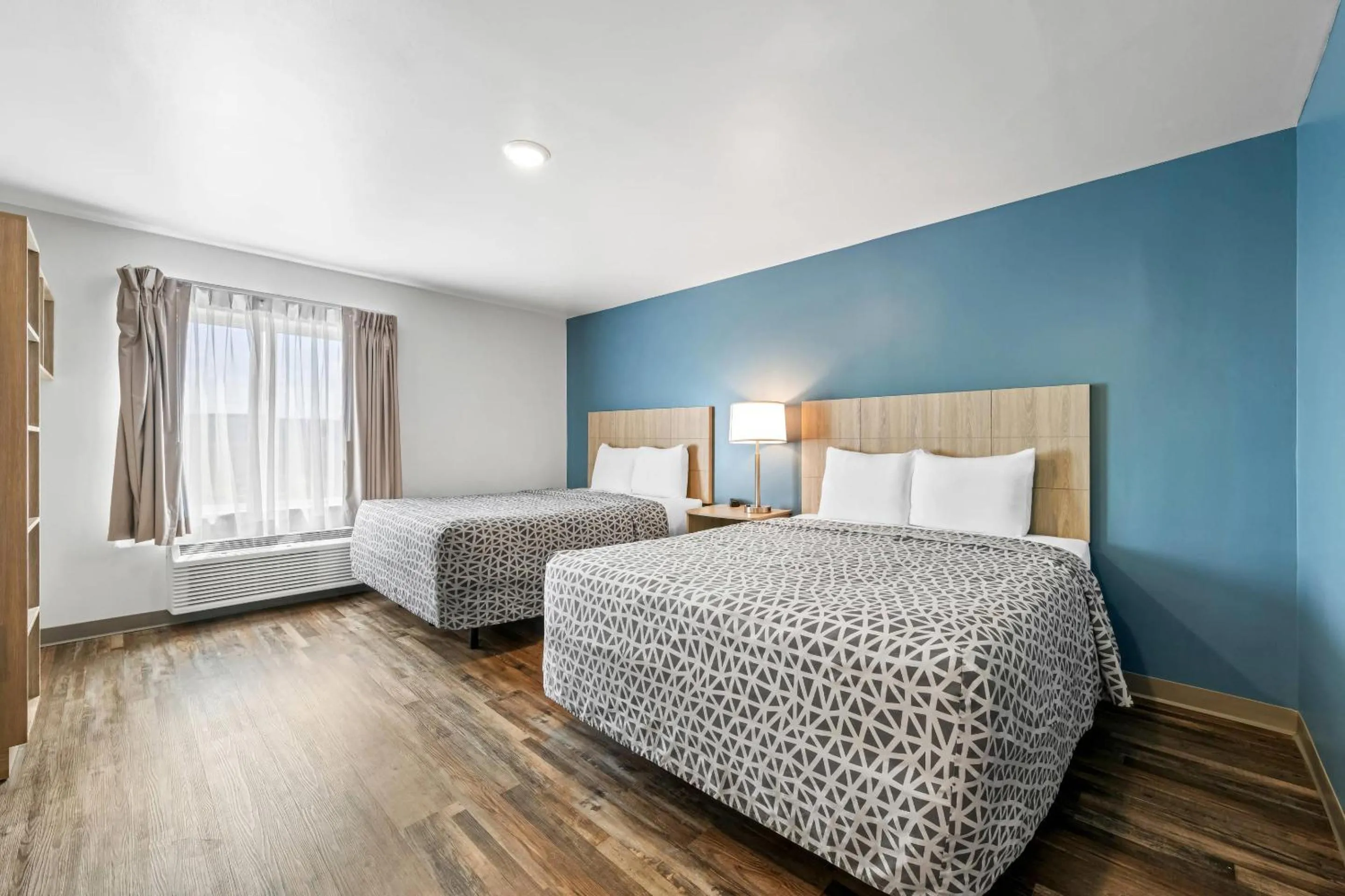 Bedroom, Bed in WoodSpring Suites Winston-Salem near Hanes Mall