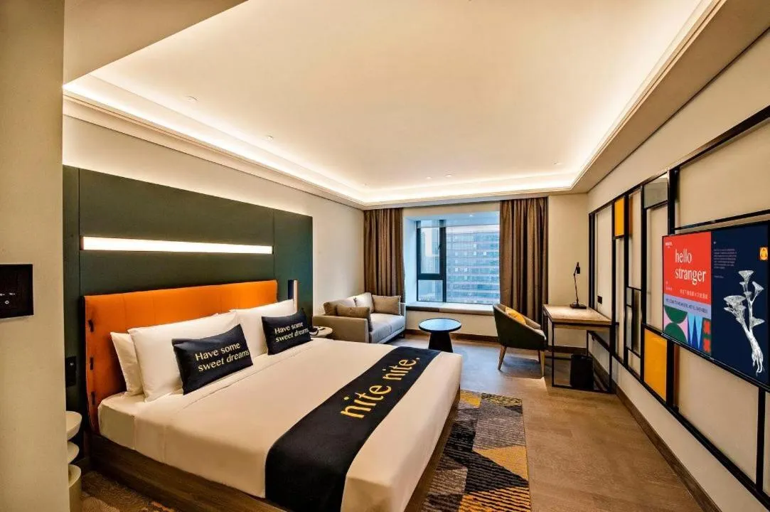 Bed in MUSTEL Hotel Guangzhou Nansha