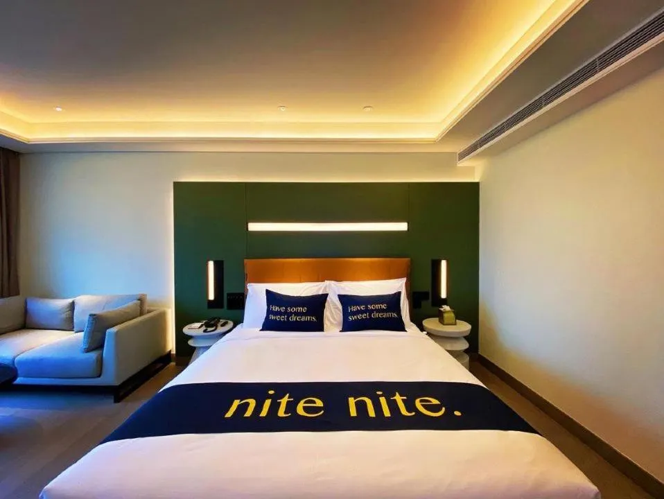Bed in MUSTEL Hotel Guangzhou Nansha
