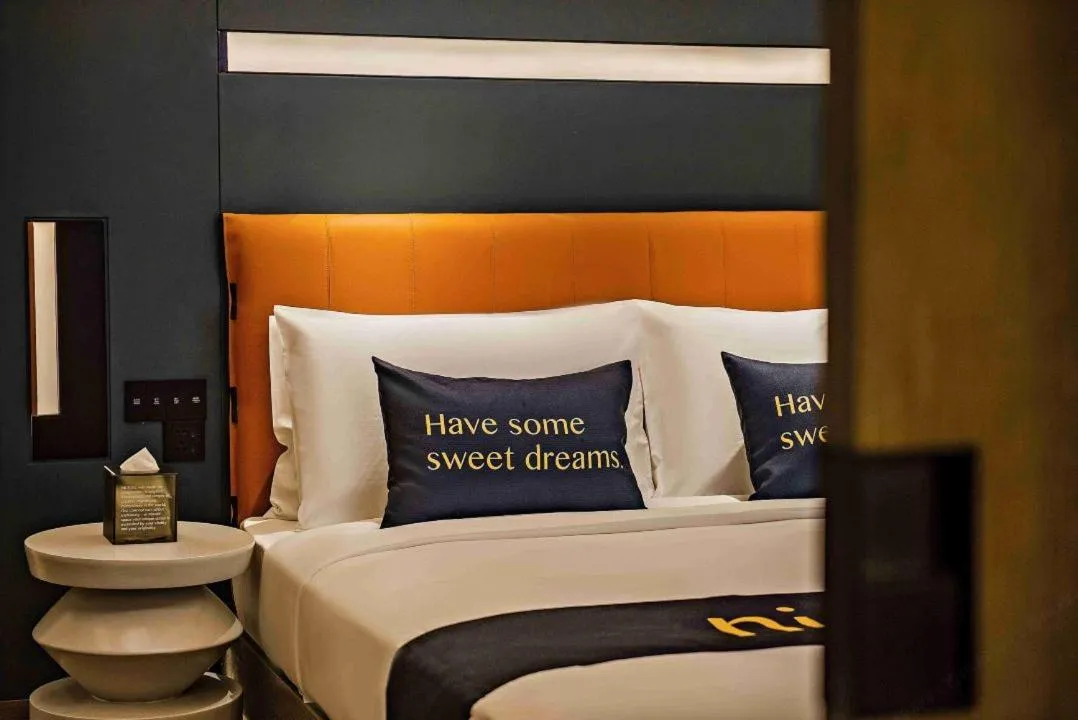 Bed in MUSTEL Hotel Guangzhou Nansha