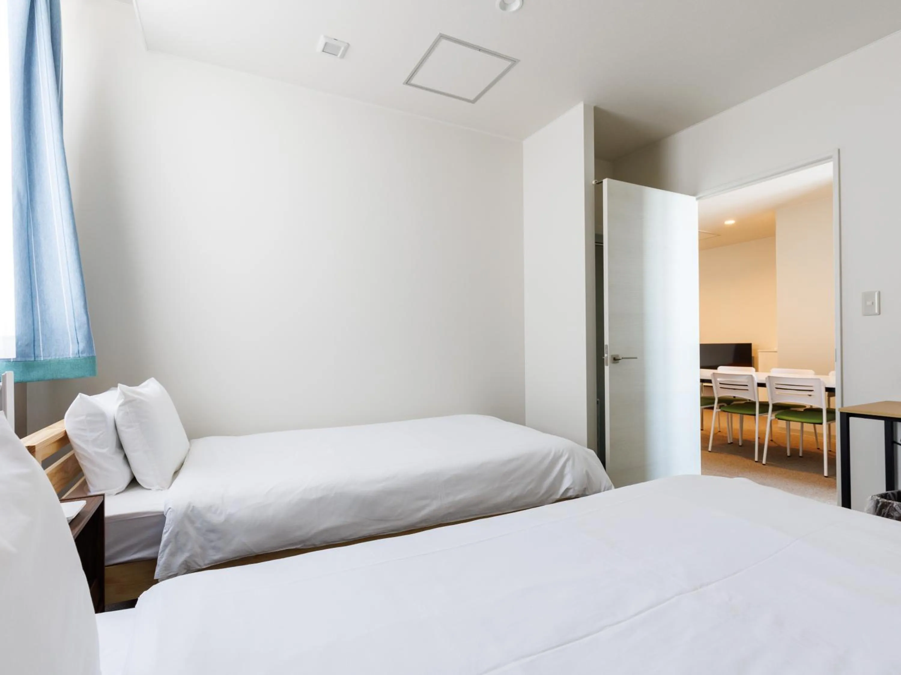 Bed in Tabist Kitami Athlete Stays