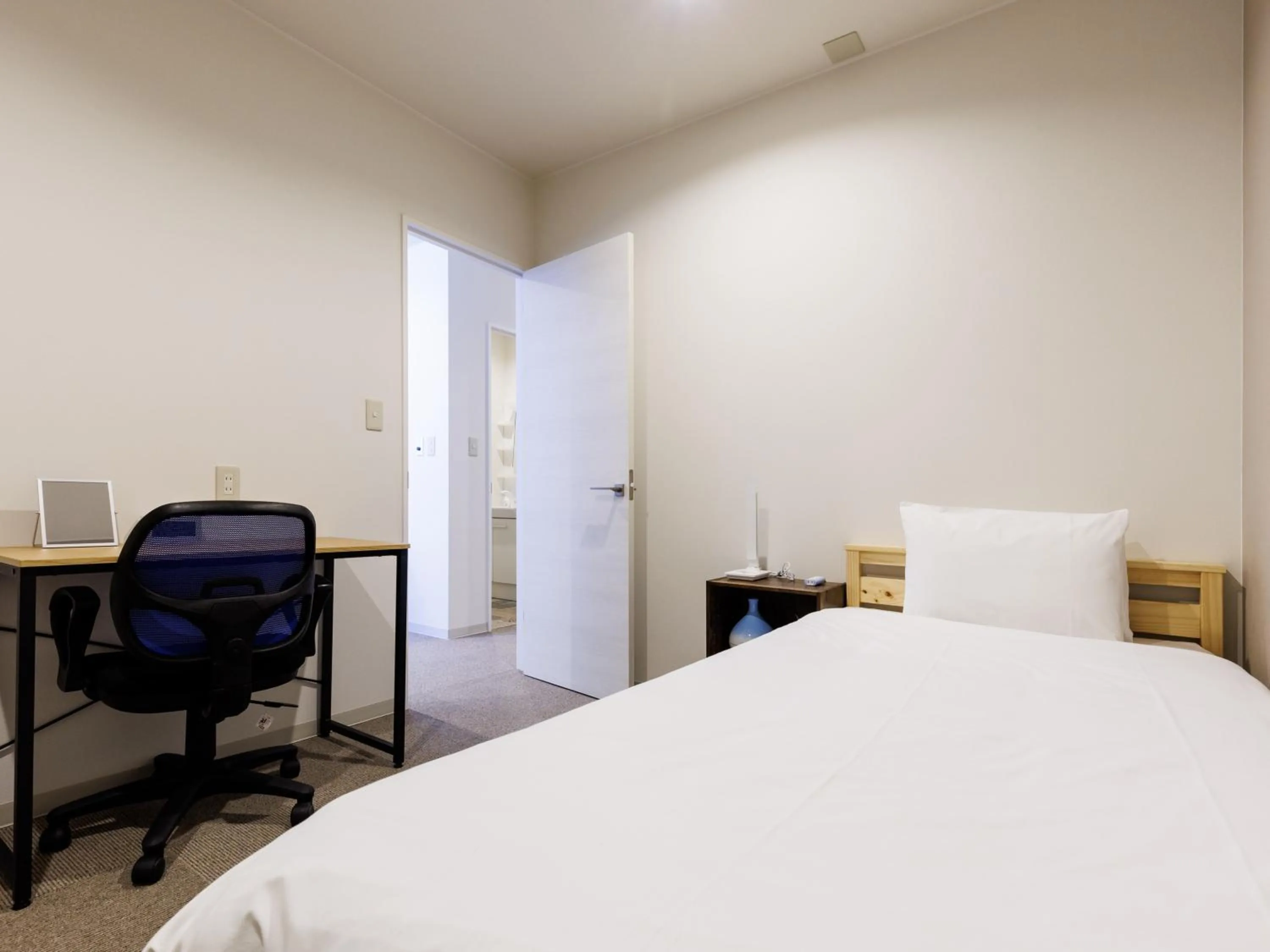 Bed in Tabist Kitami Athlete Stays