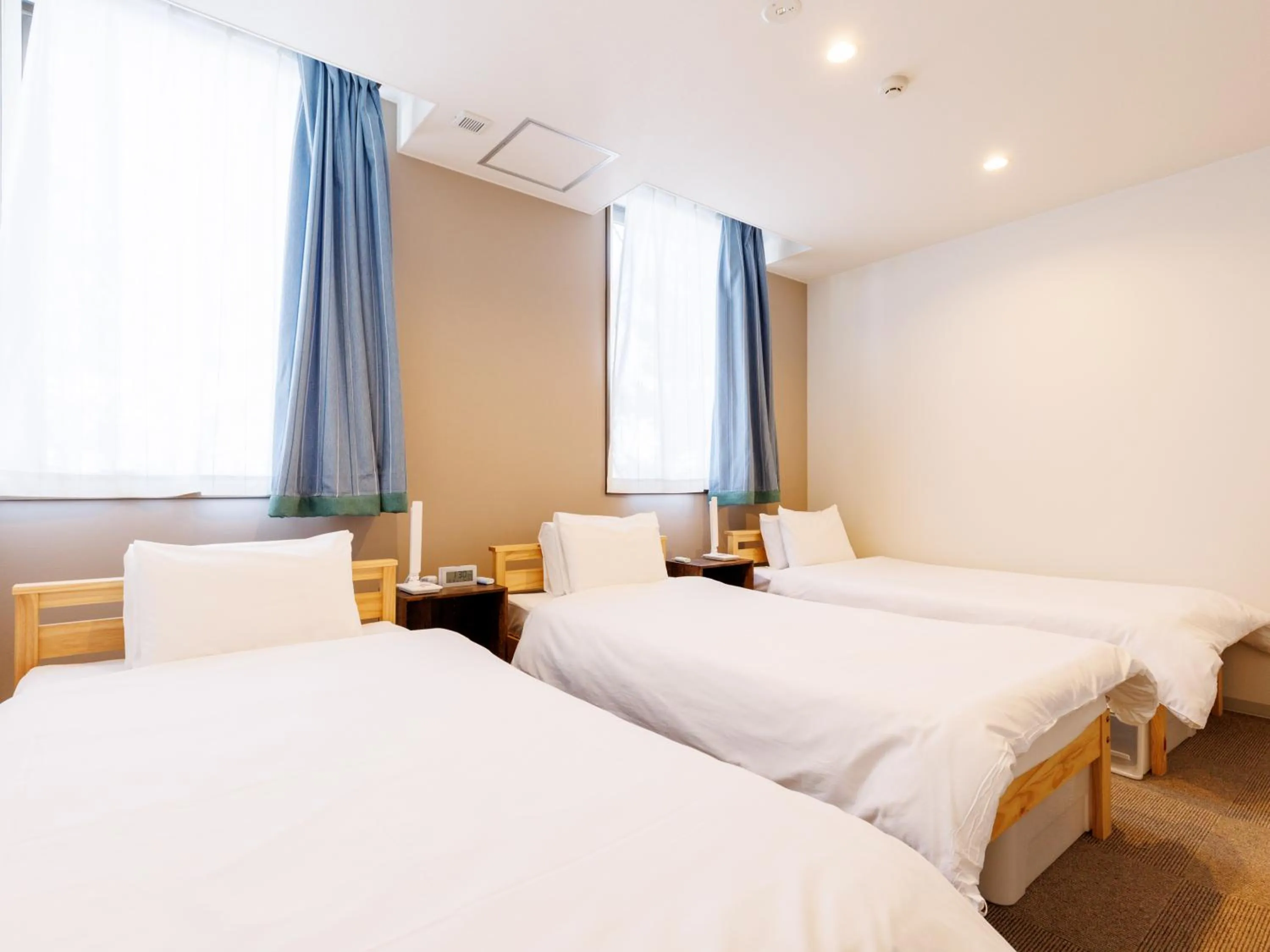 Bed in Tabist Kitami Athlete Stays