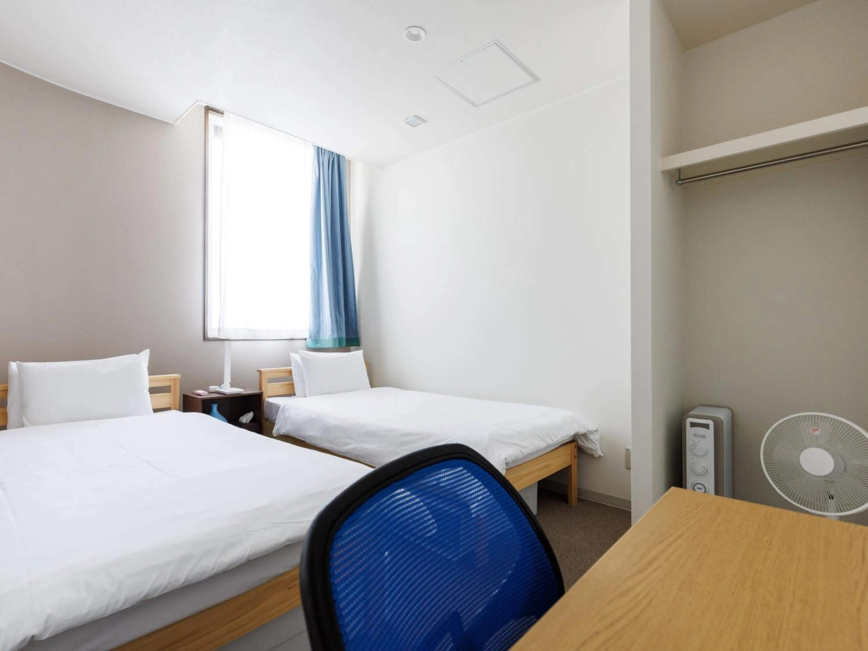 Bed in Tabist Kitami Athlete Stays