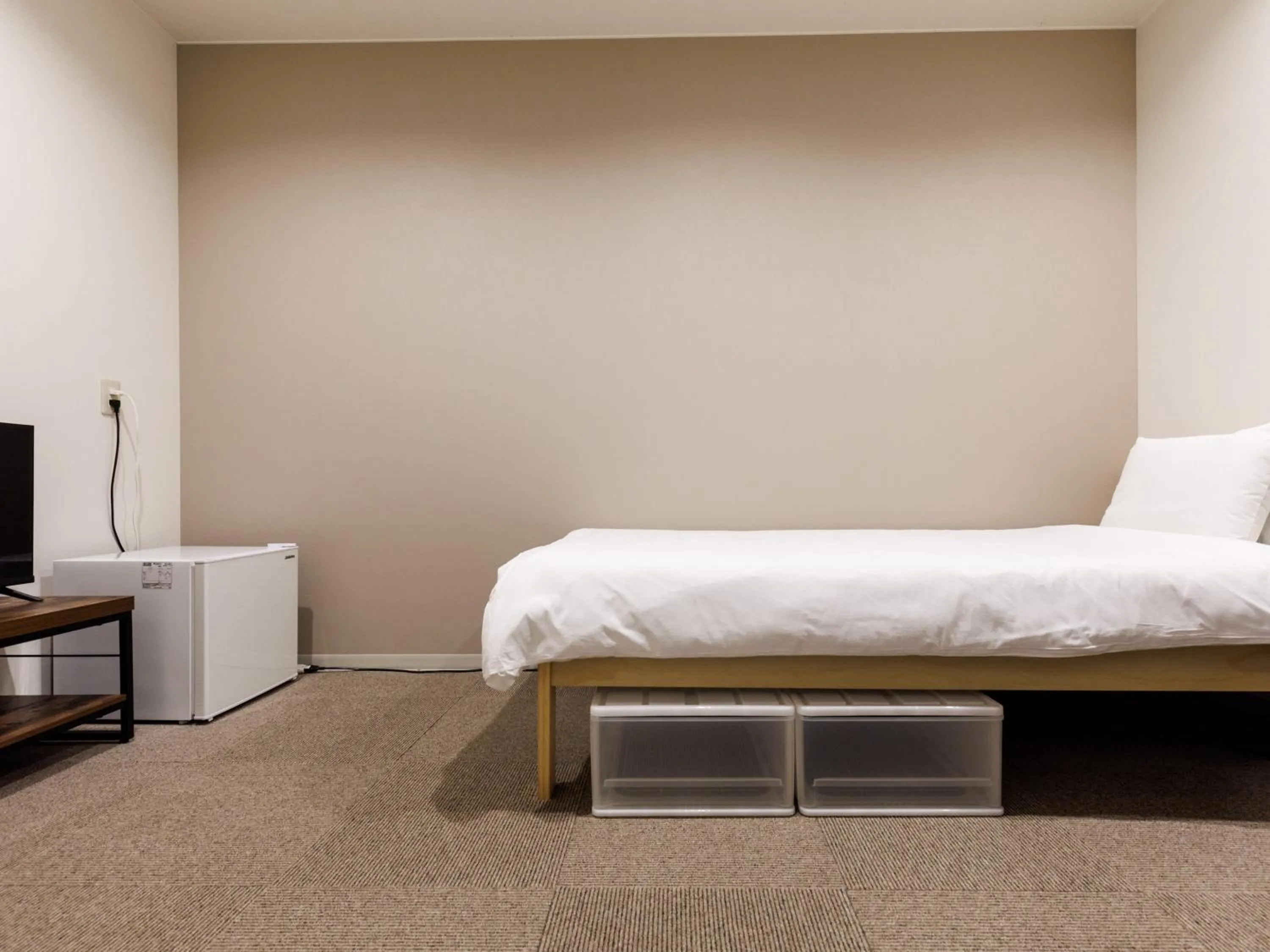 Bed in Tabist Kitami Athlete Stays