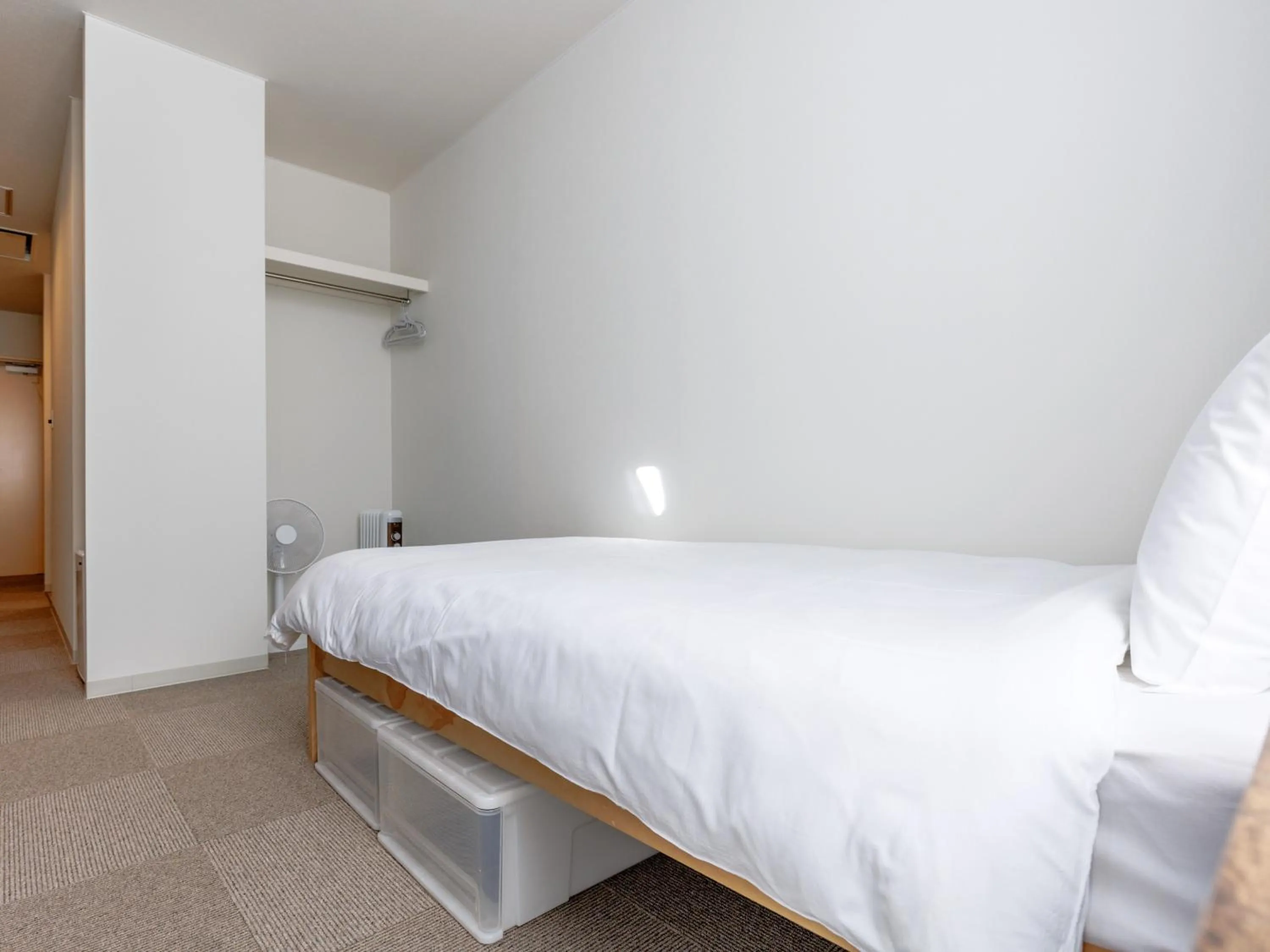 Bed in Tabist Kitami Athlete Stays