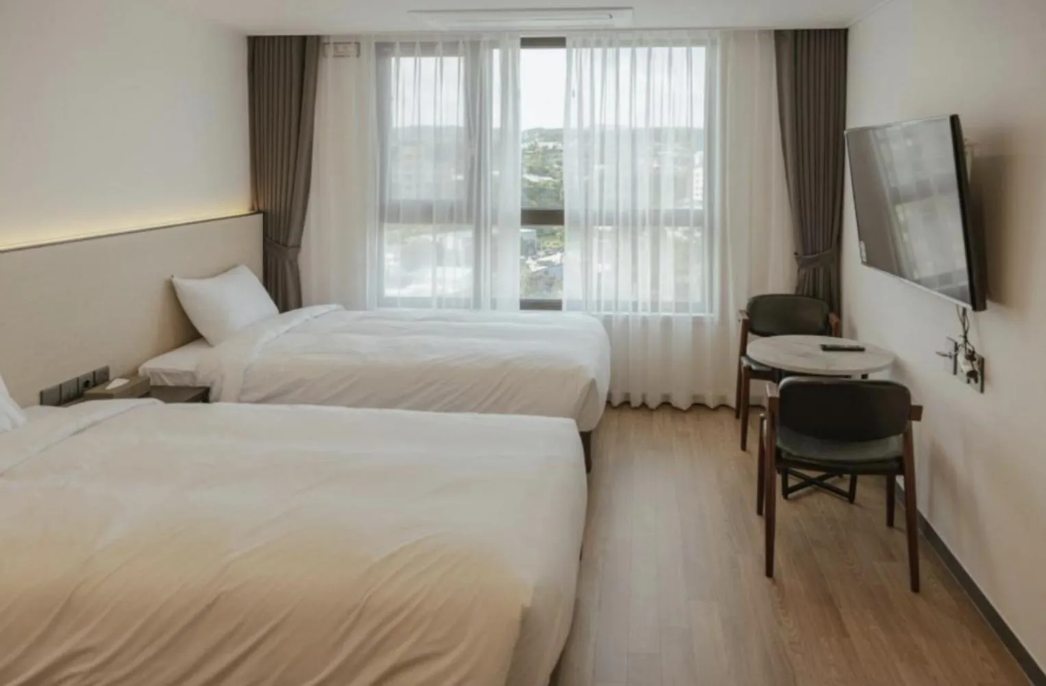 Bed in Lemain Hotel Seogwipo