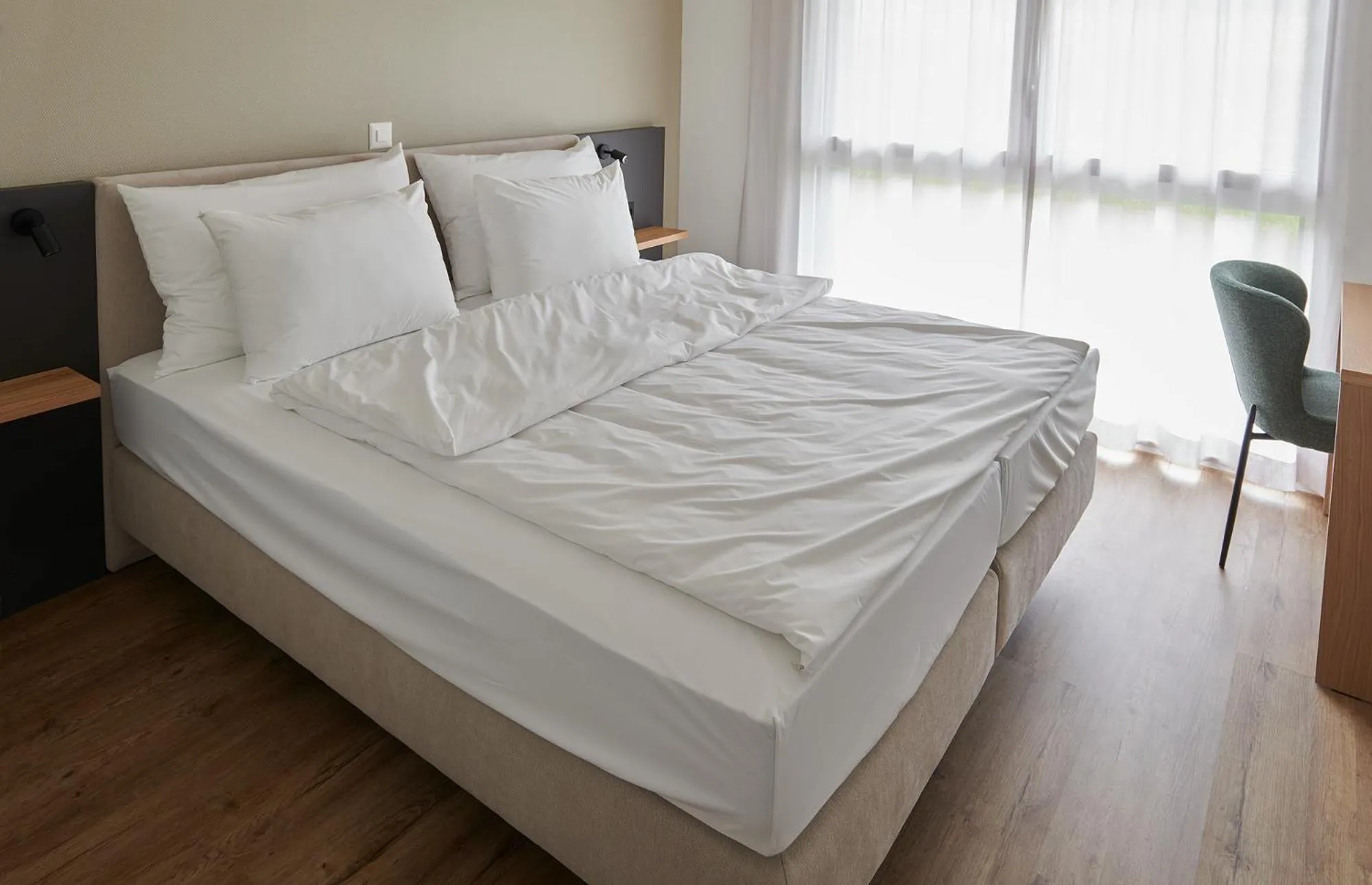 Bed in Hotel Jäger Jeuss - Murten - Self-Check-in