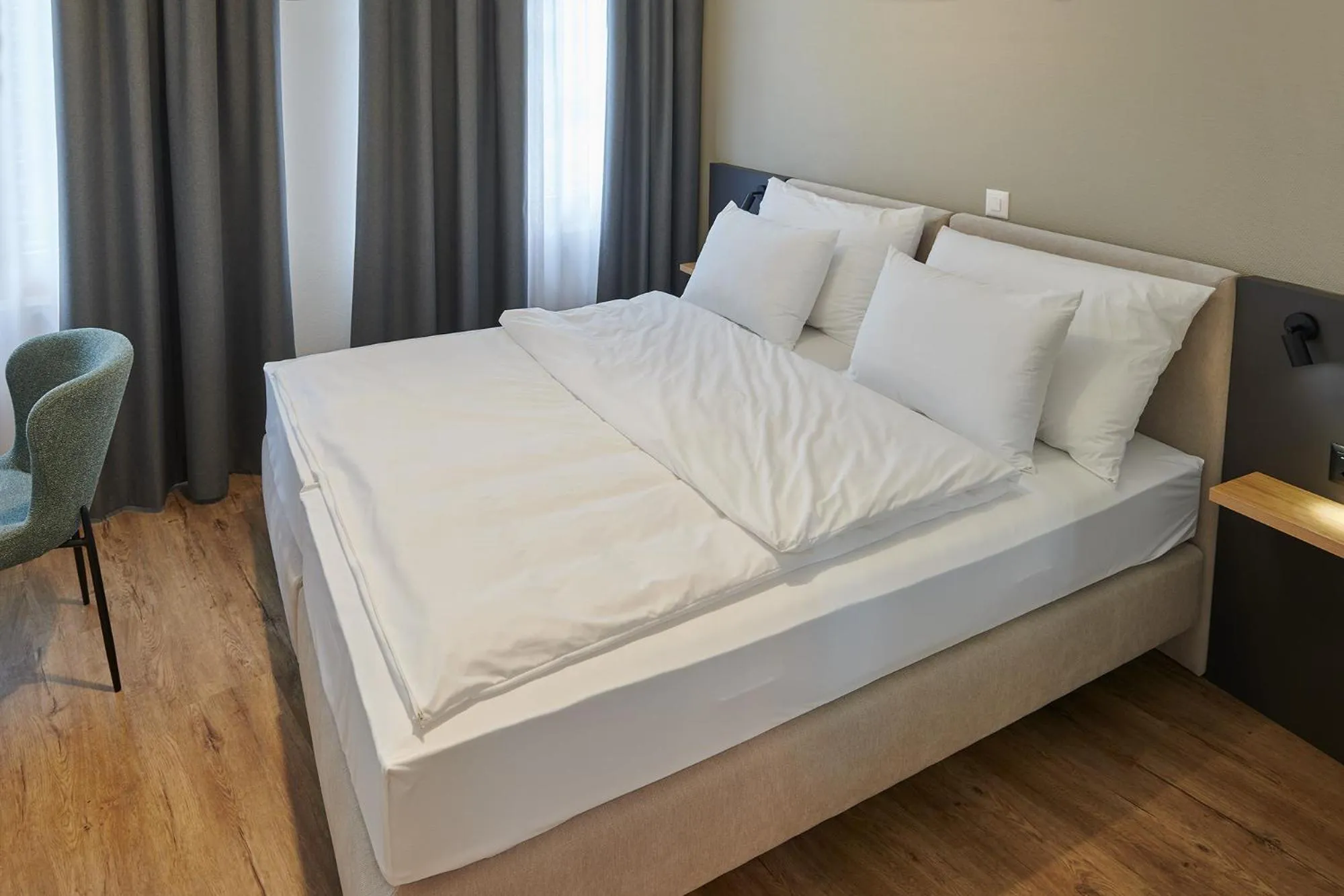 Bed in Hotel Jäger Jeuss - Murten - Self-Check-in