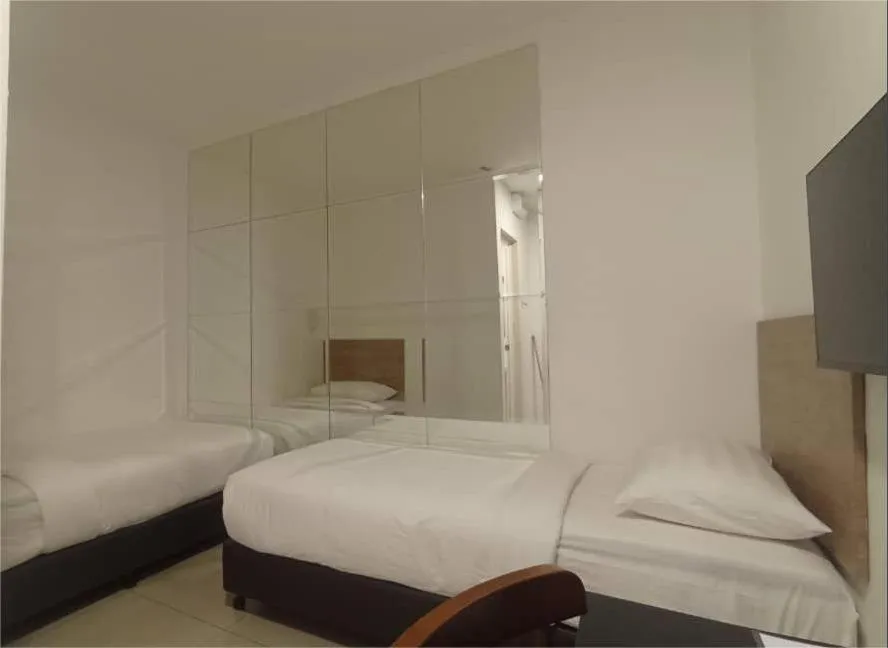 Bed in BIG TREE HOTEL