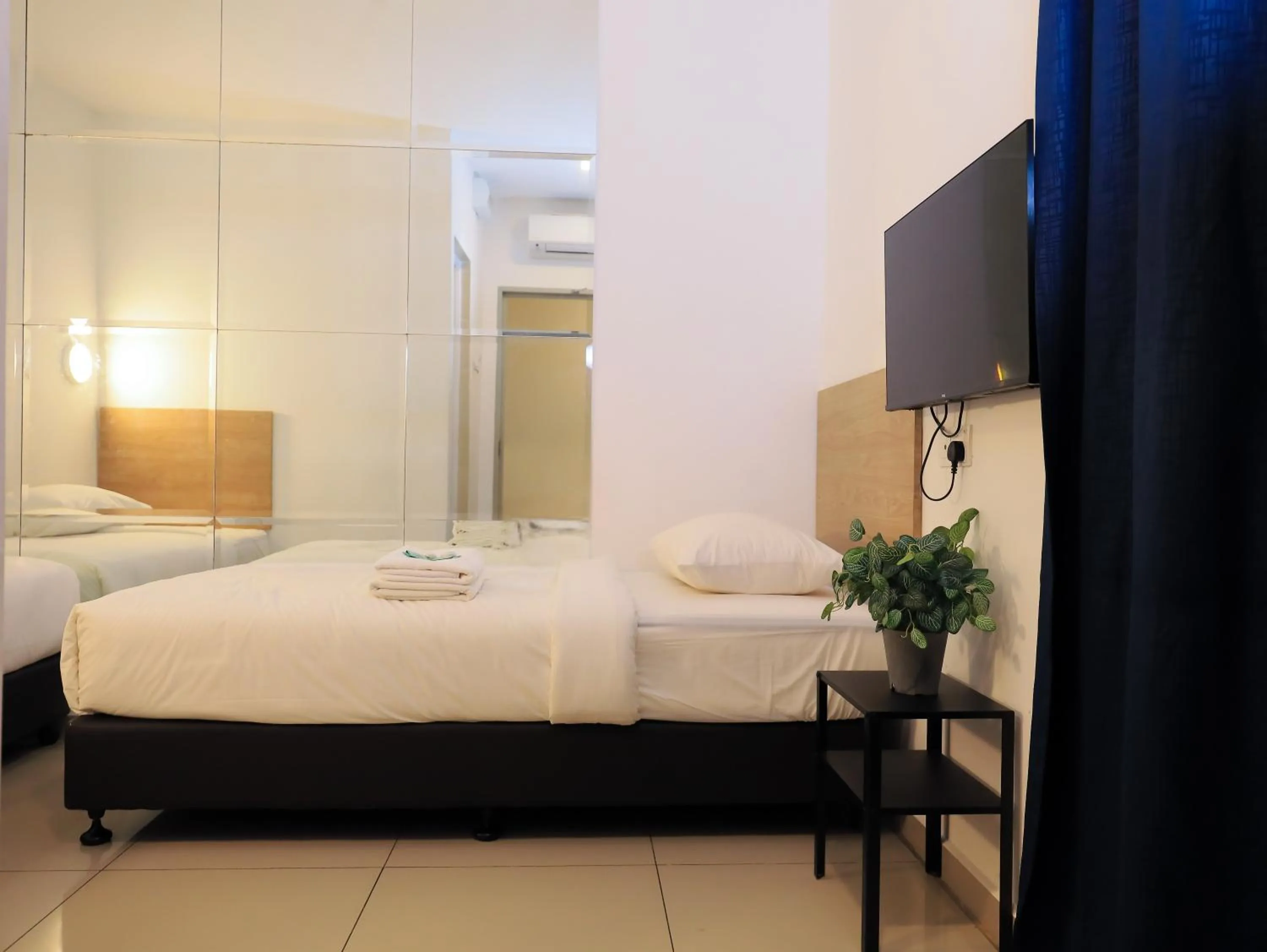 Bed in BIG TREE HOTEL