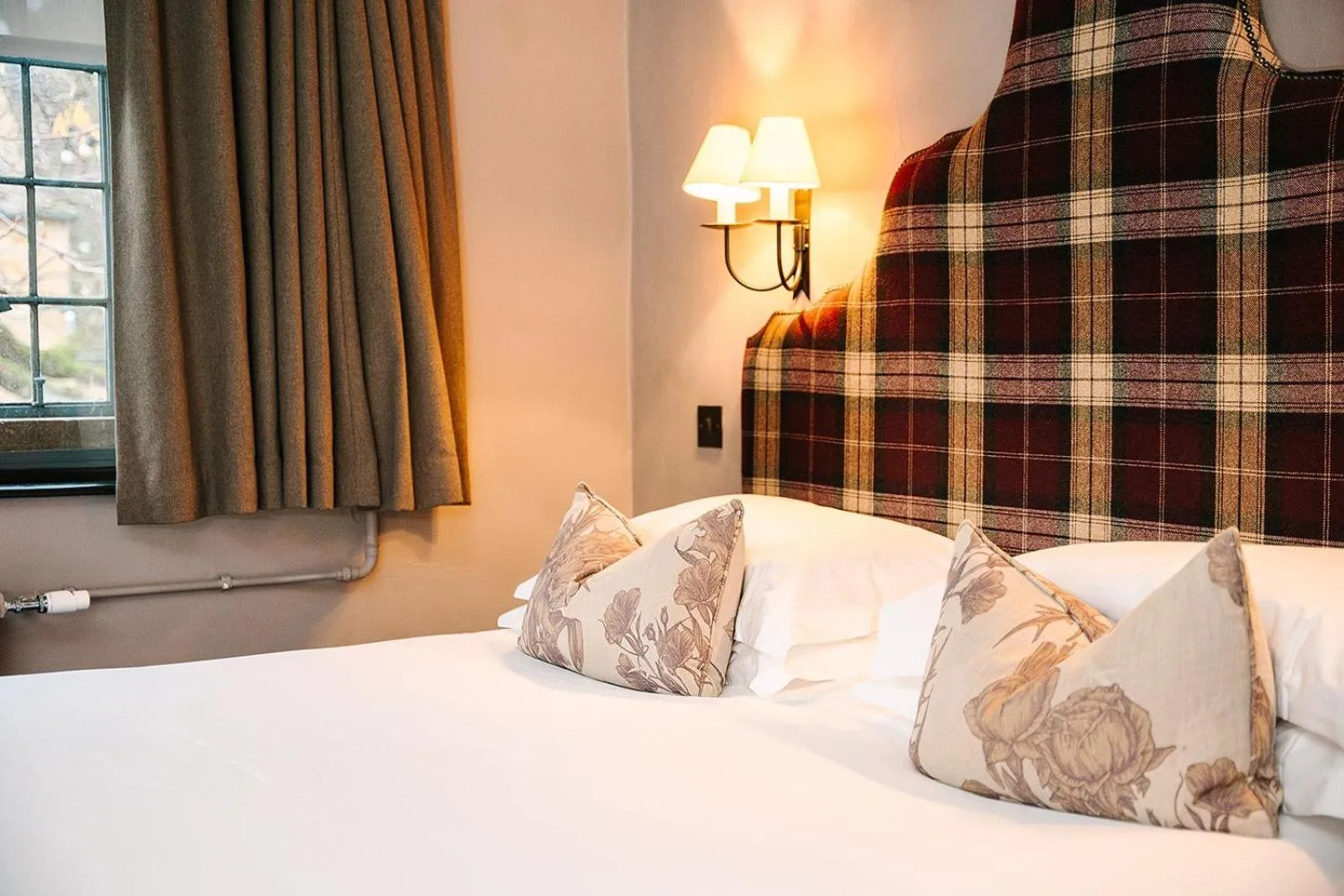 Bed in The Lygon Arms - an Iconic Luxury Hotel