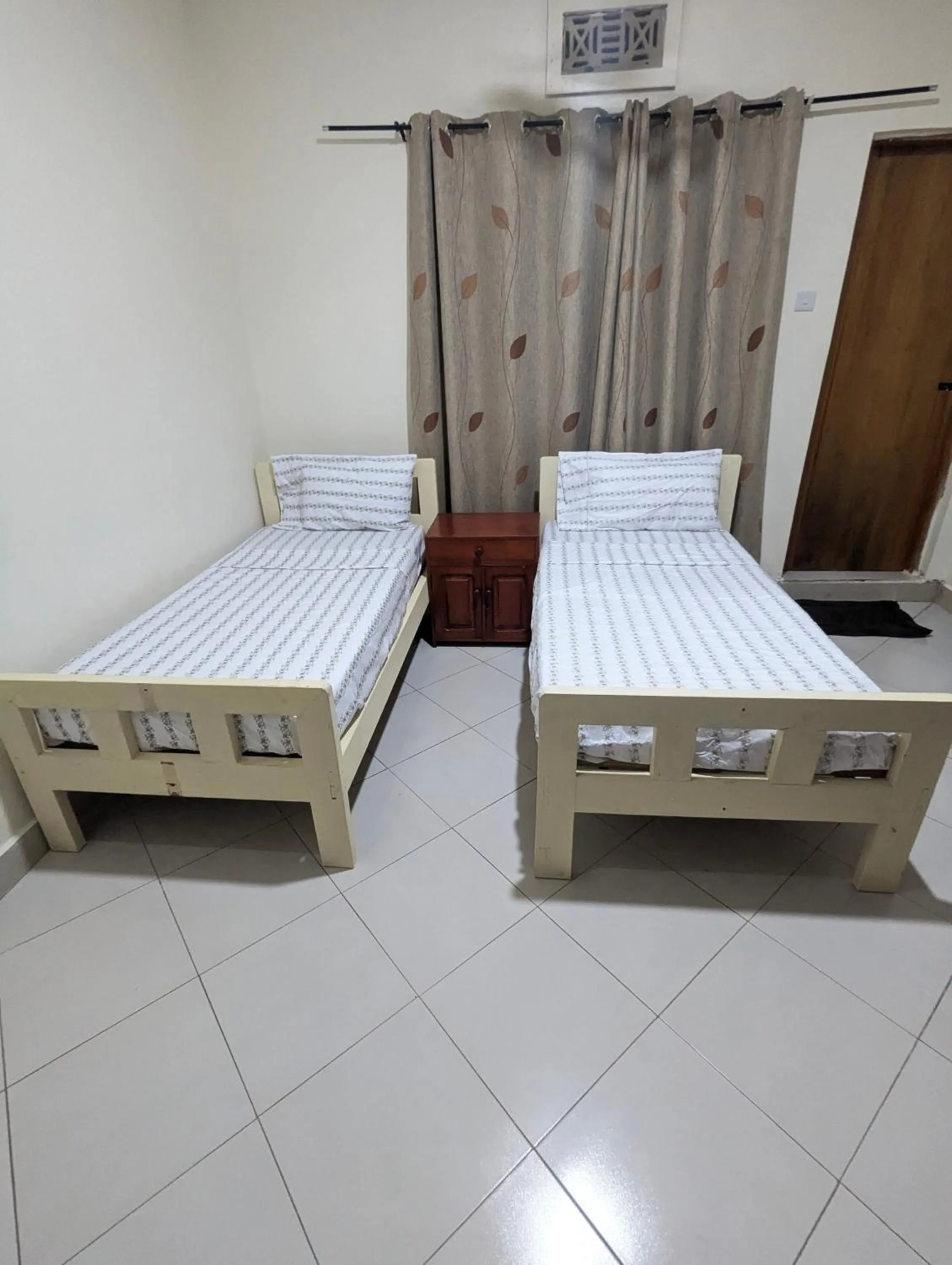 Bed in JACARANDA HOMESTAY