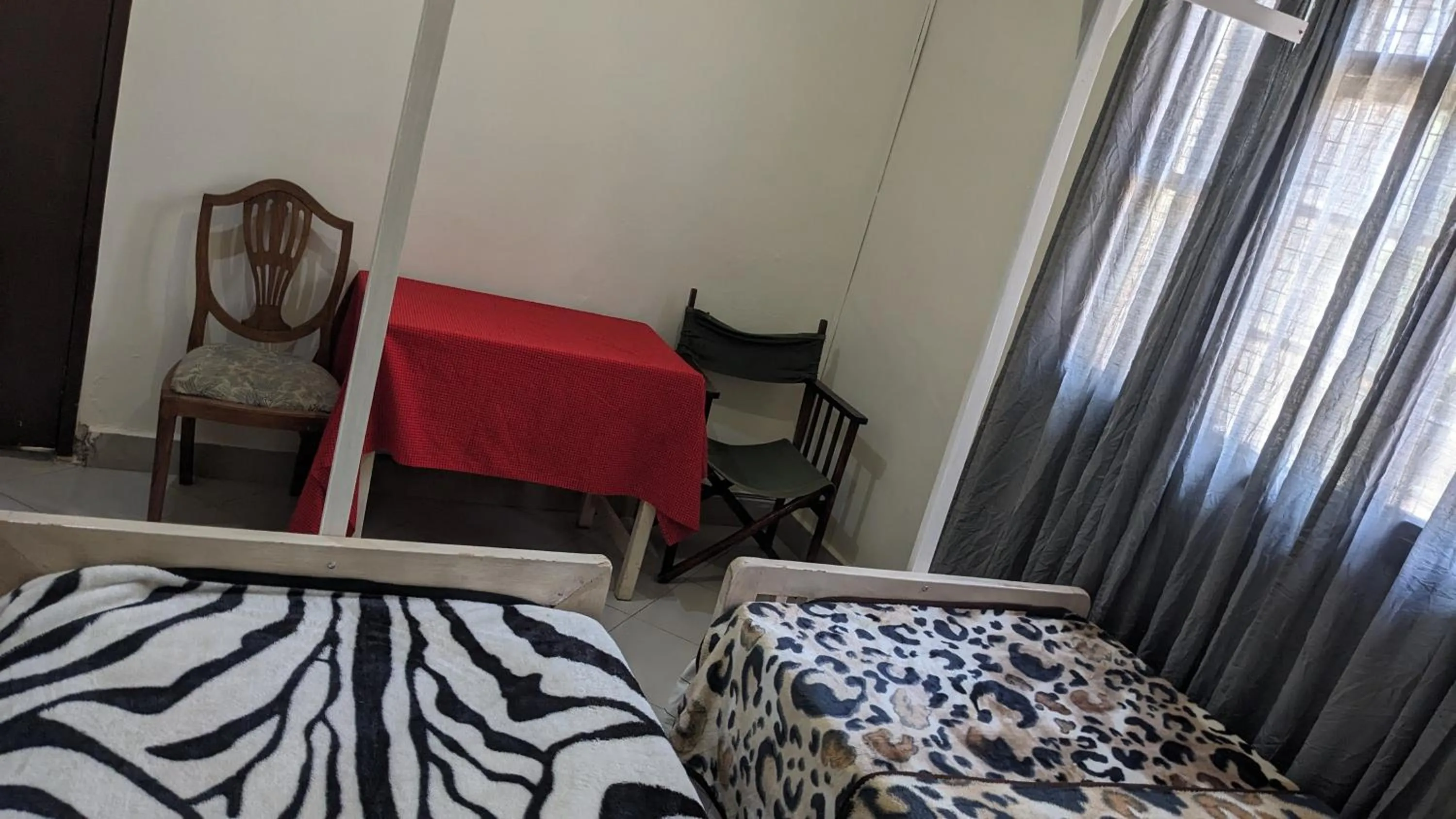 Bed in JACARANDA HOMESTAY