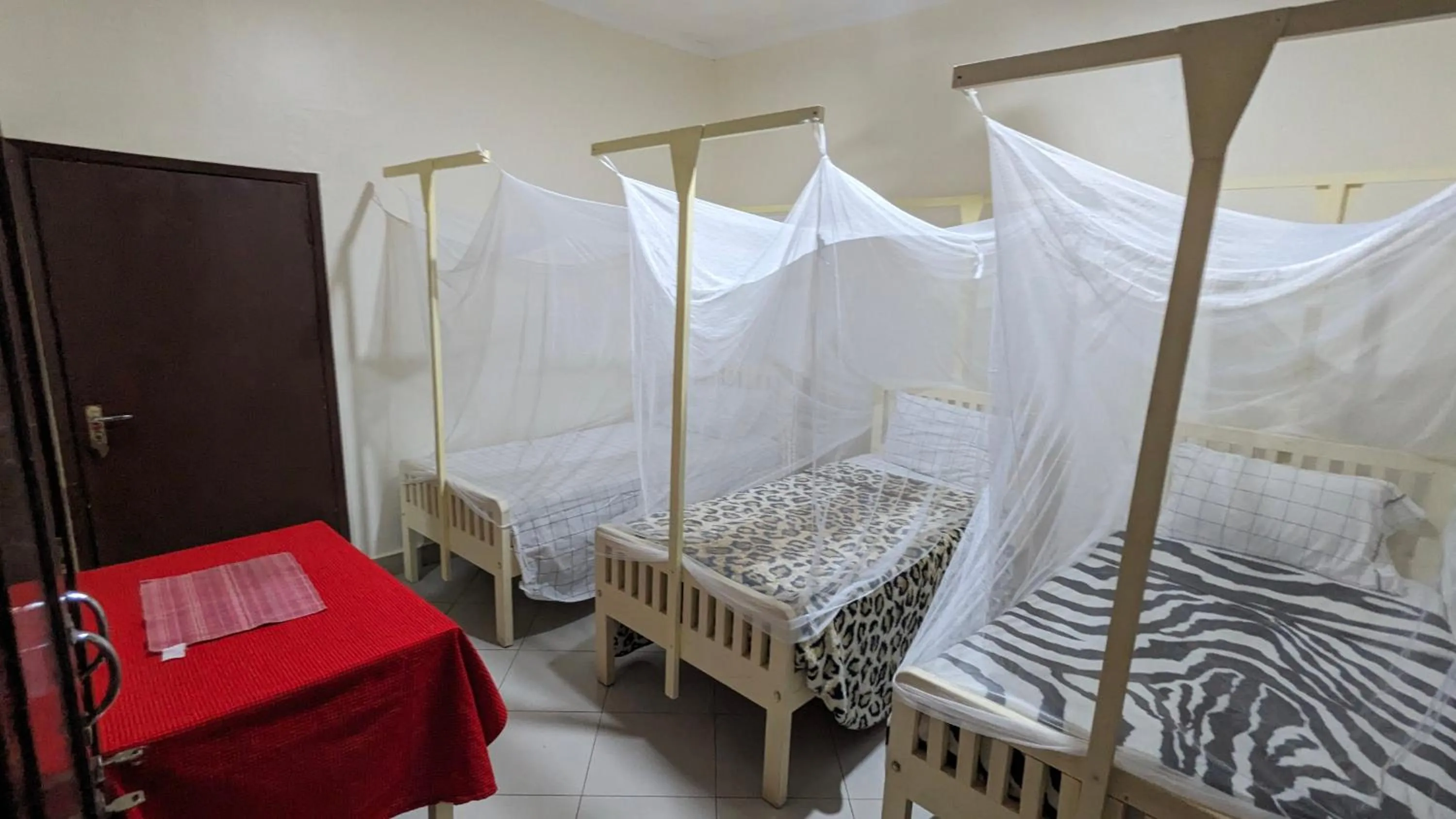 Bed in JACARANDA HOMESTAY