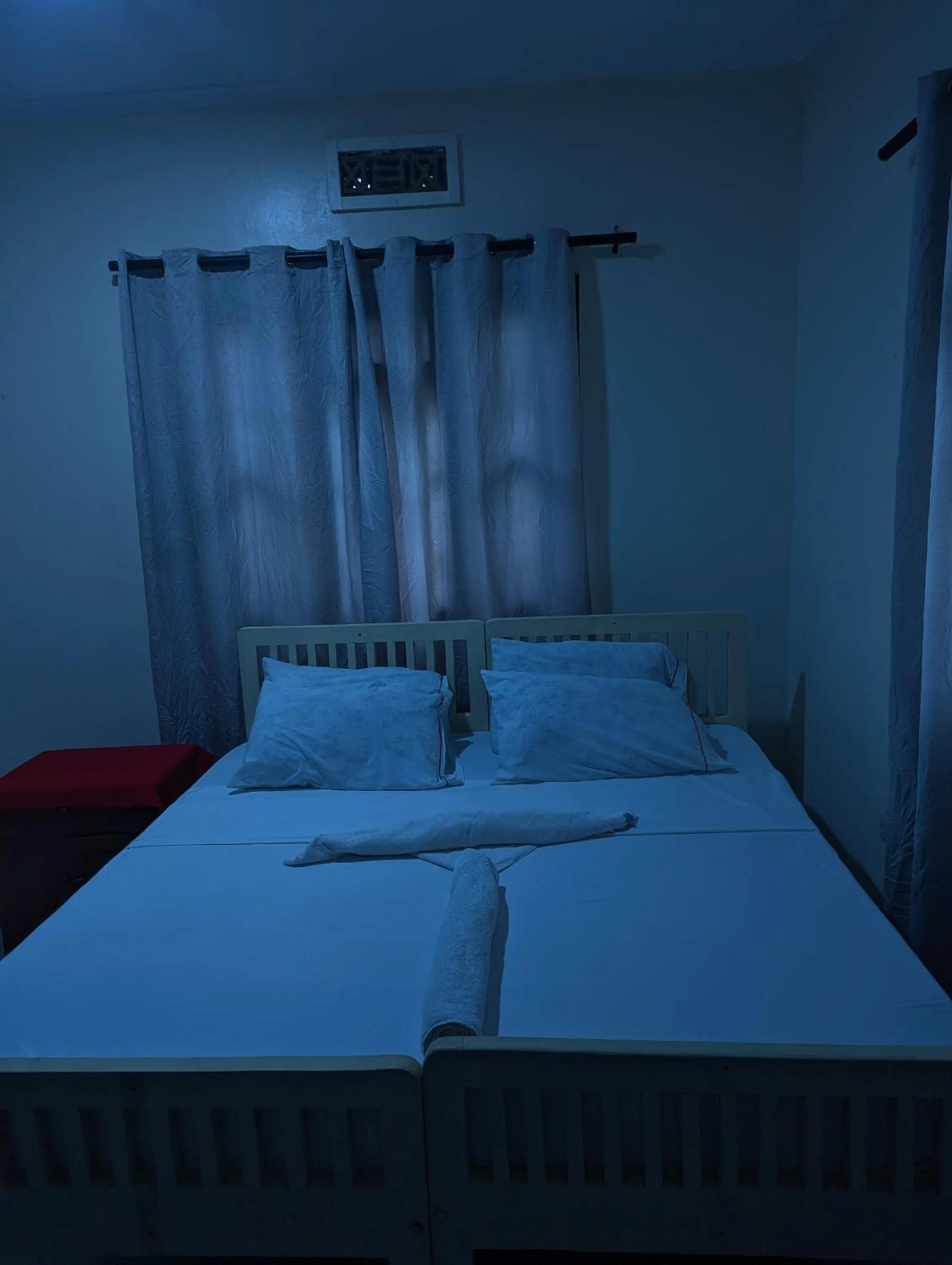 Bed in JACARANDA HOMESTAY