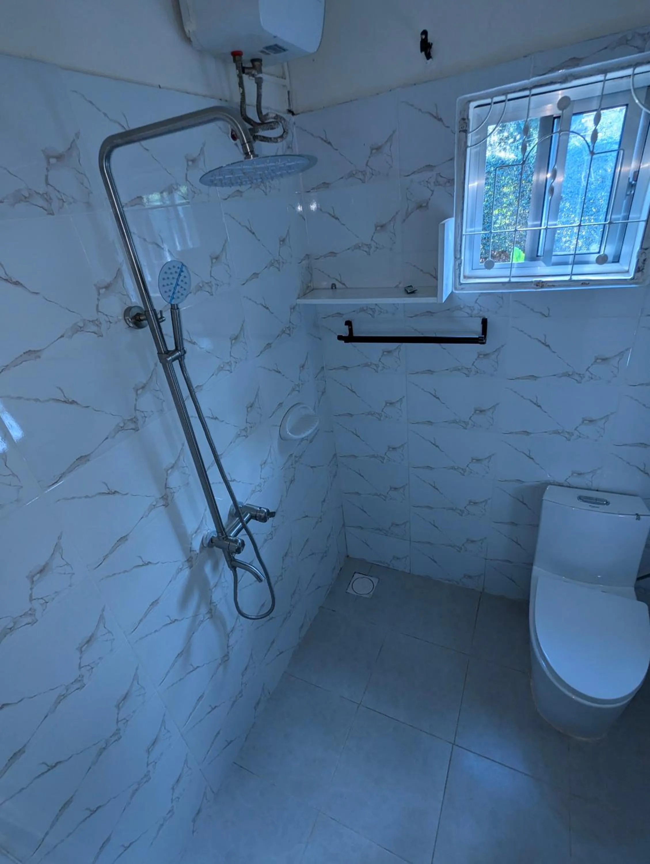 Shower in JACARANDA HOMESTAY