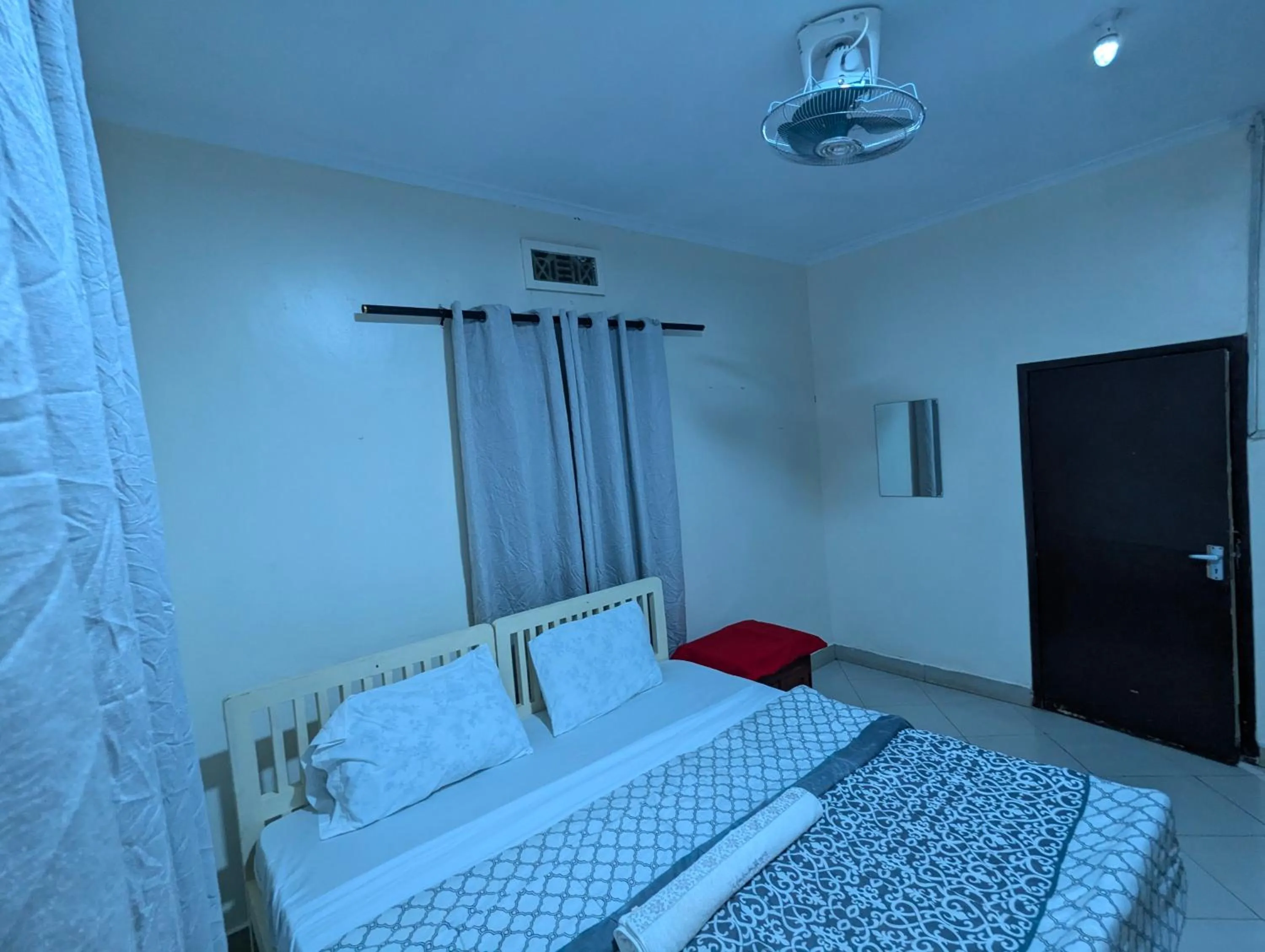 Bed in JACARANDA HOMESTAY